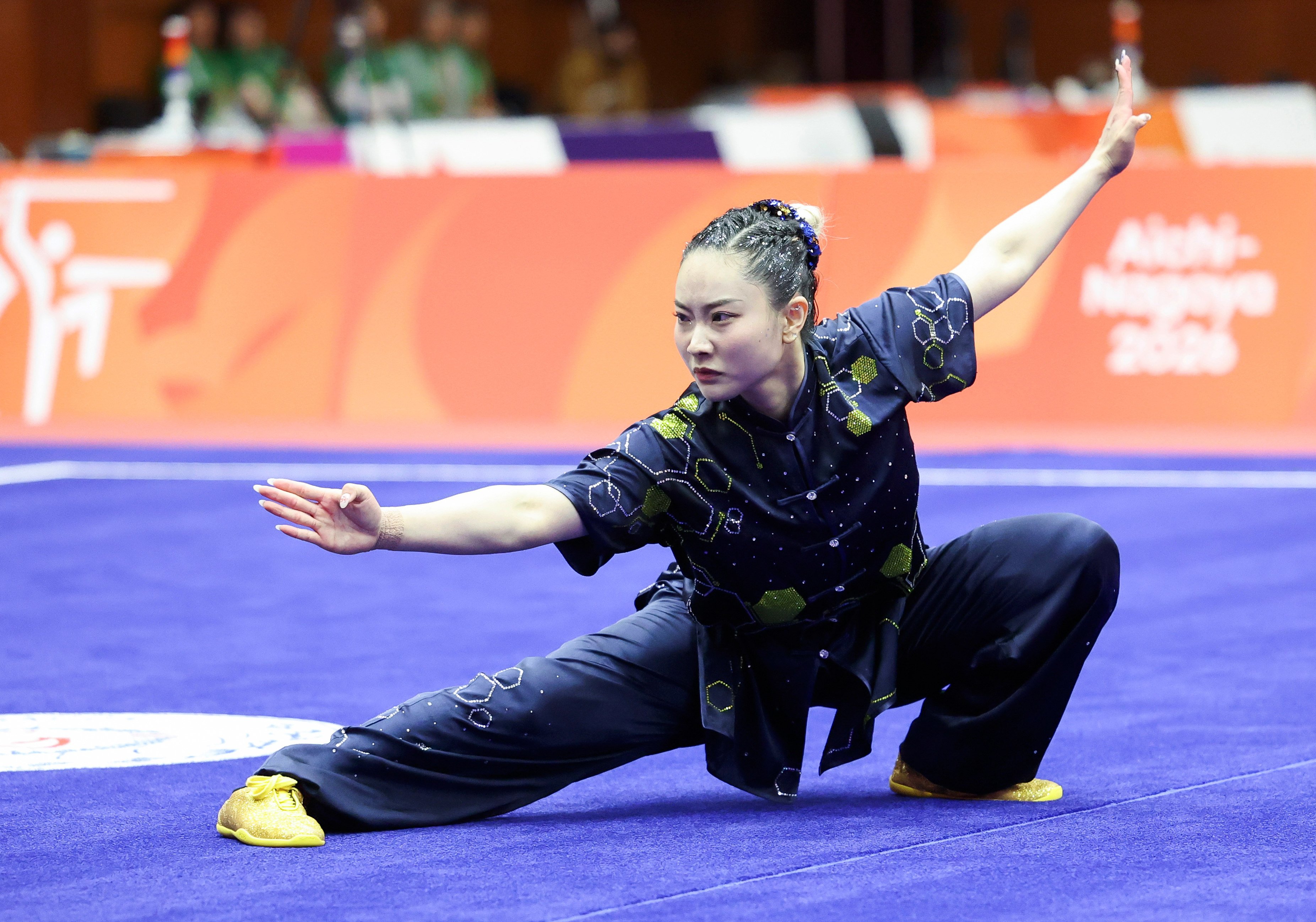 Lydia Sham got the medal tally started on the second day with victory in the women’s wushu changquan at the Asian Games. Photo: Xinhua