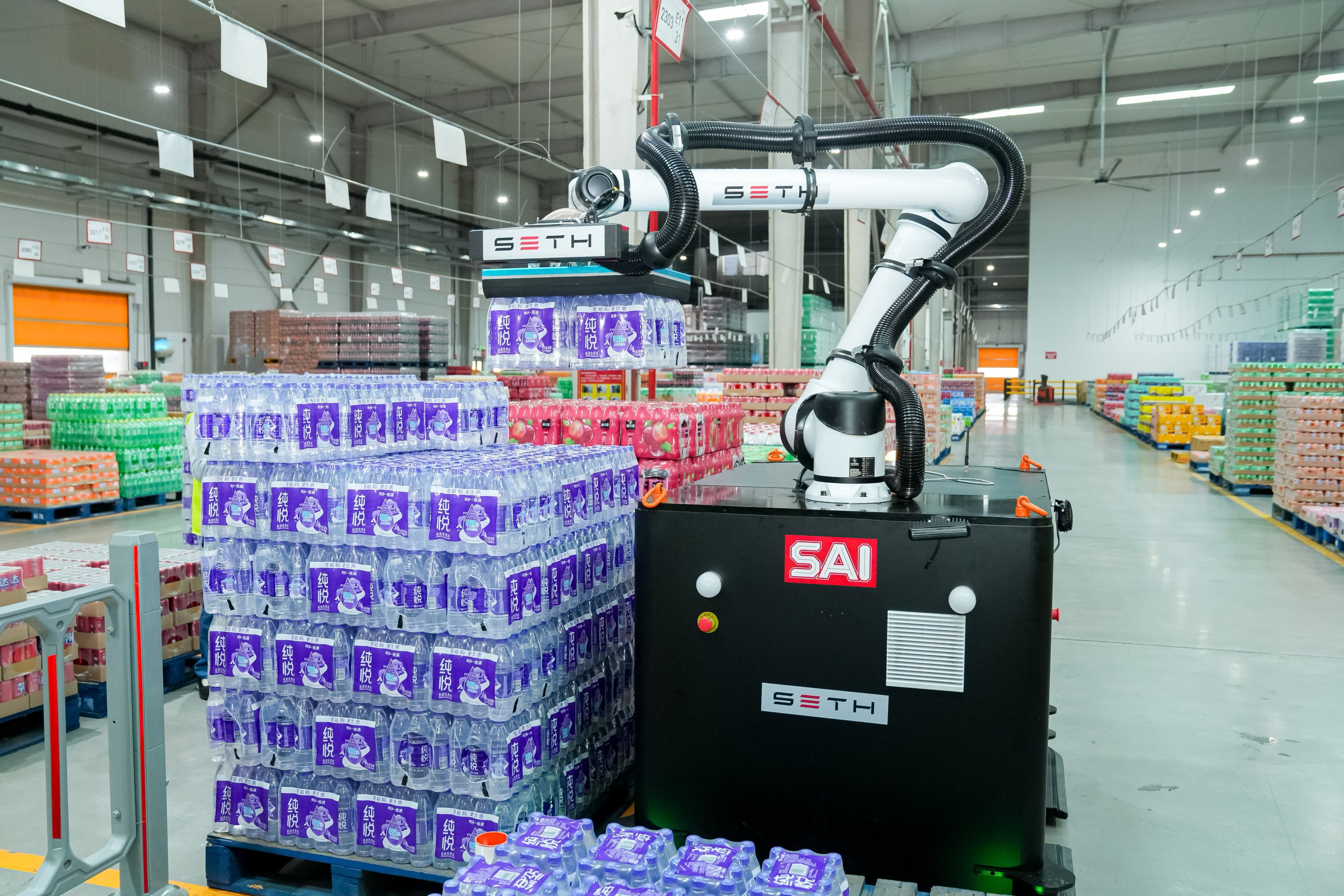 A robot developed by Hangzhou-based Seth Robotics picking goods at Swire Coca-Cola’s smart factory in Zhengzhou, Henan province, on Friday. Photo: Handout
