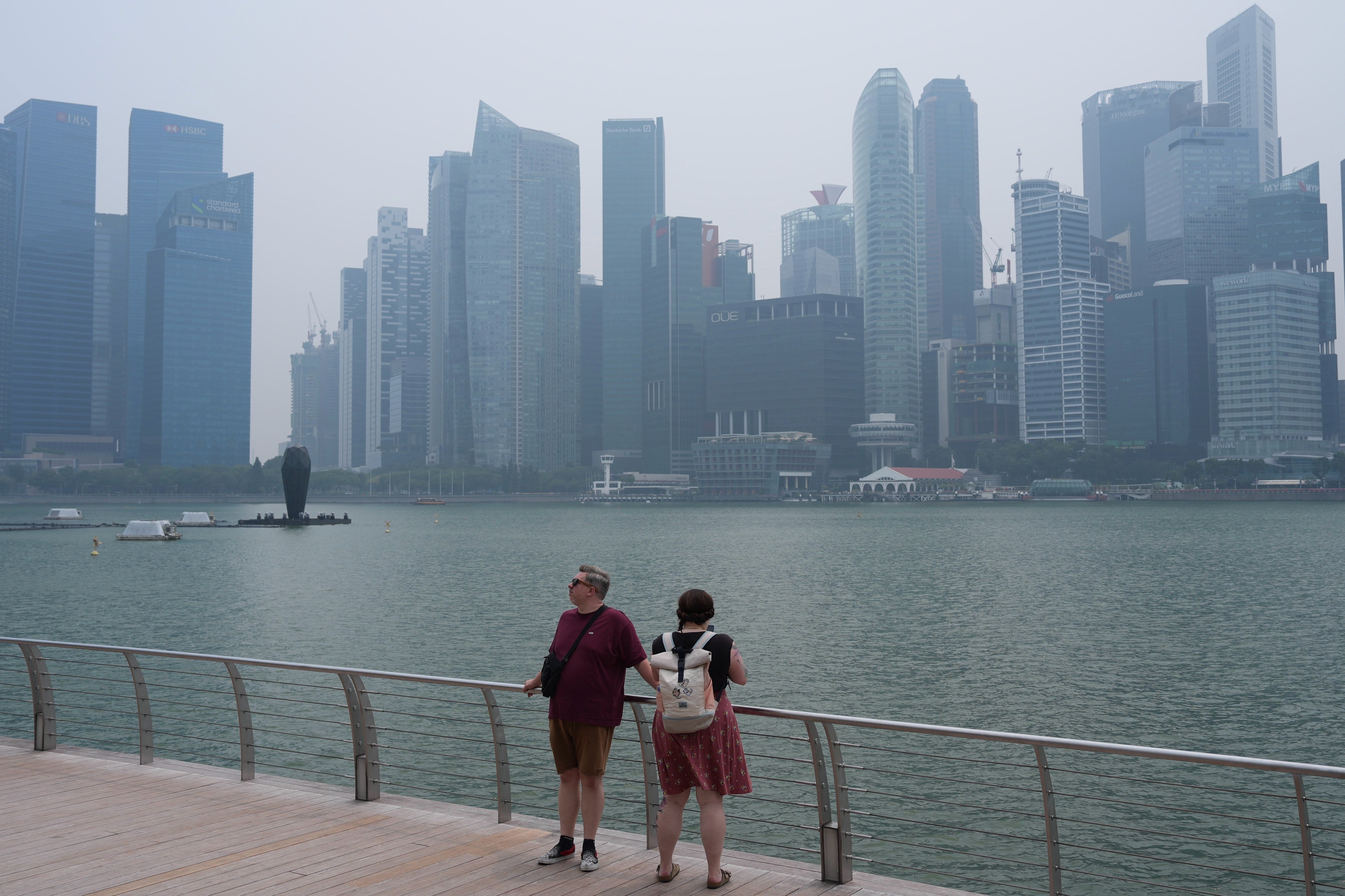 People look across Marina Bay to Singapore’s financial district skyline on September 14. Photo: AP