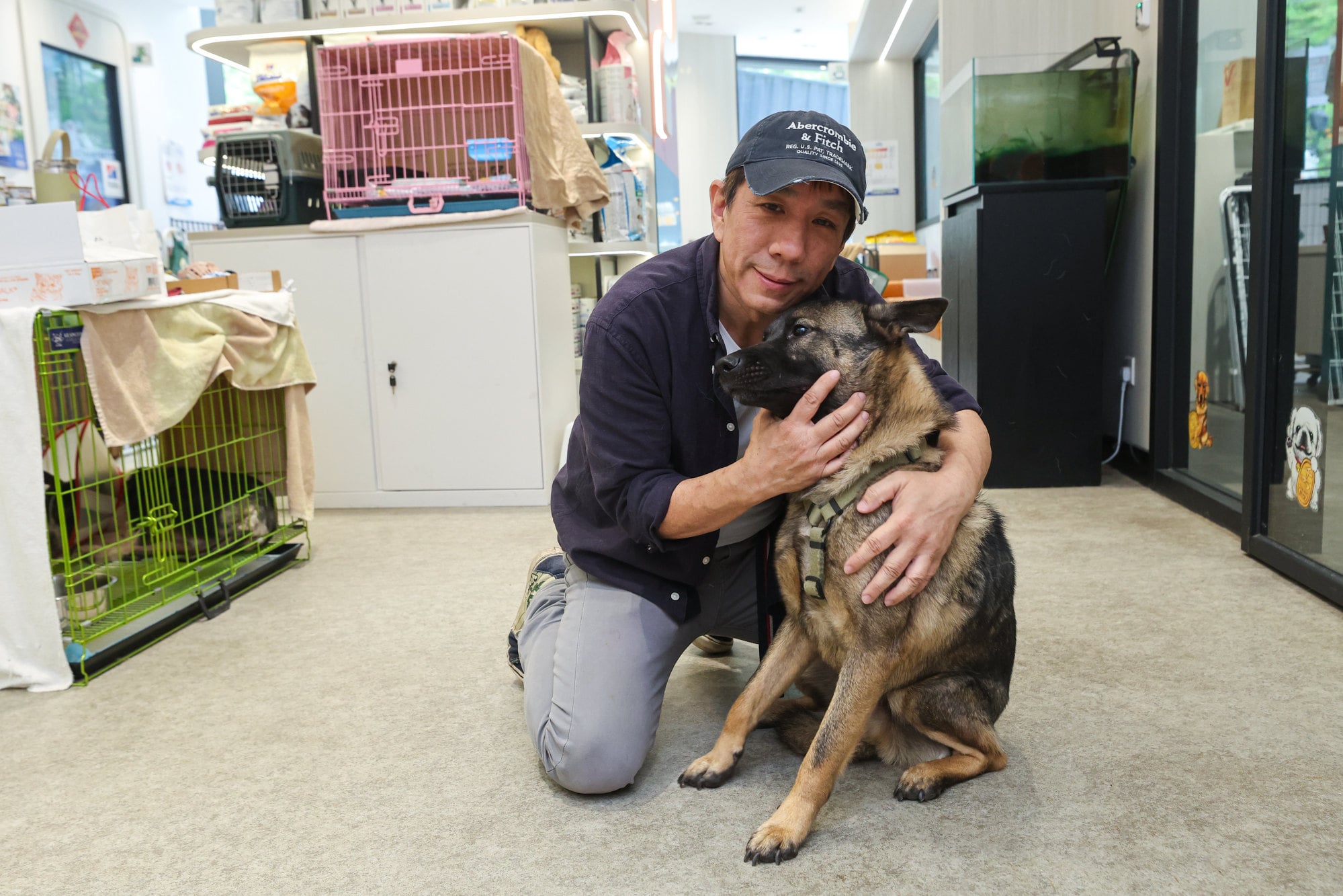 Kent Luk with a rescued stray at the Paws Guardian Veterinary Centre in Fo Tan. Photo: Edmond So