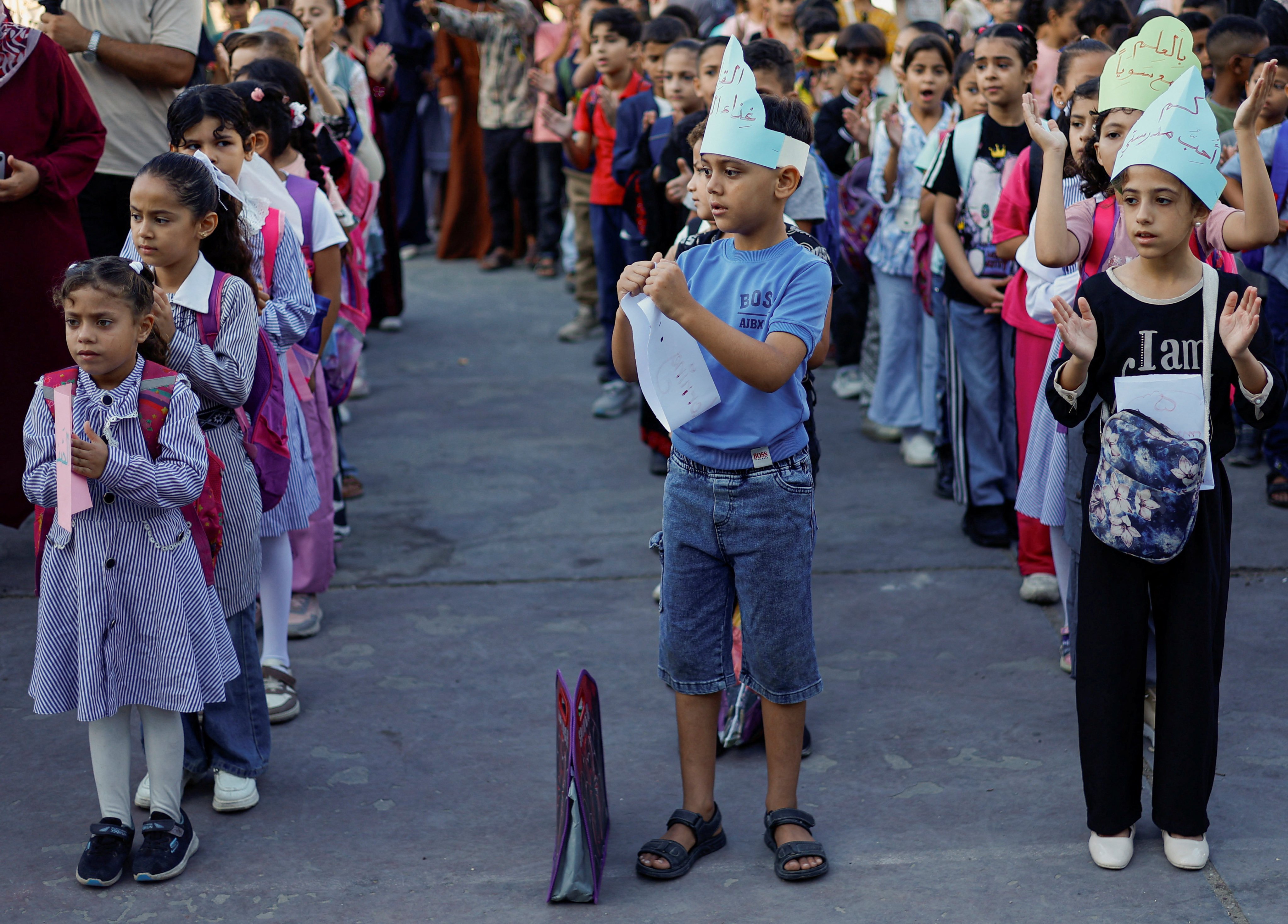 Palestinian children attend their first day of the new school year at a UN school in the central Gaza Strip on Saturday. Photo: Reuters