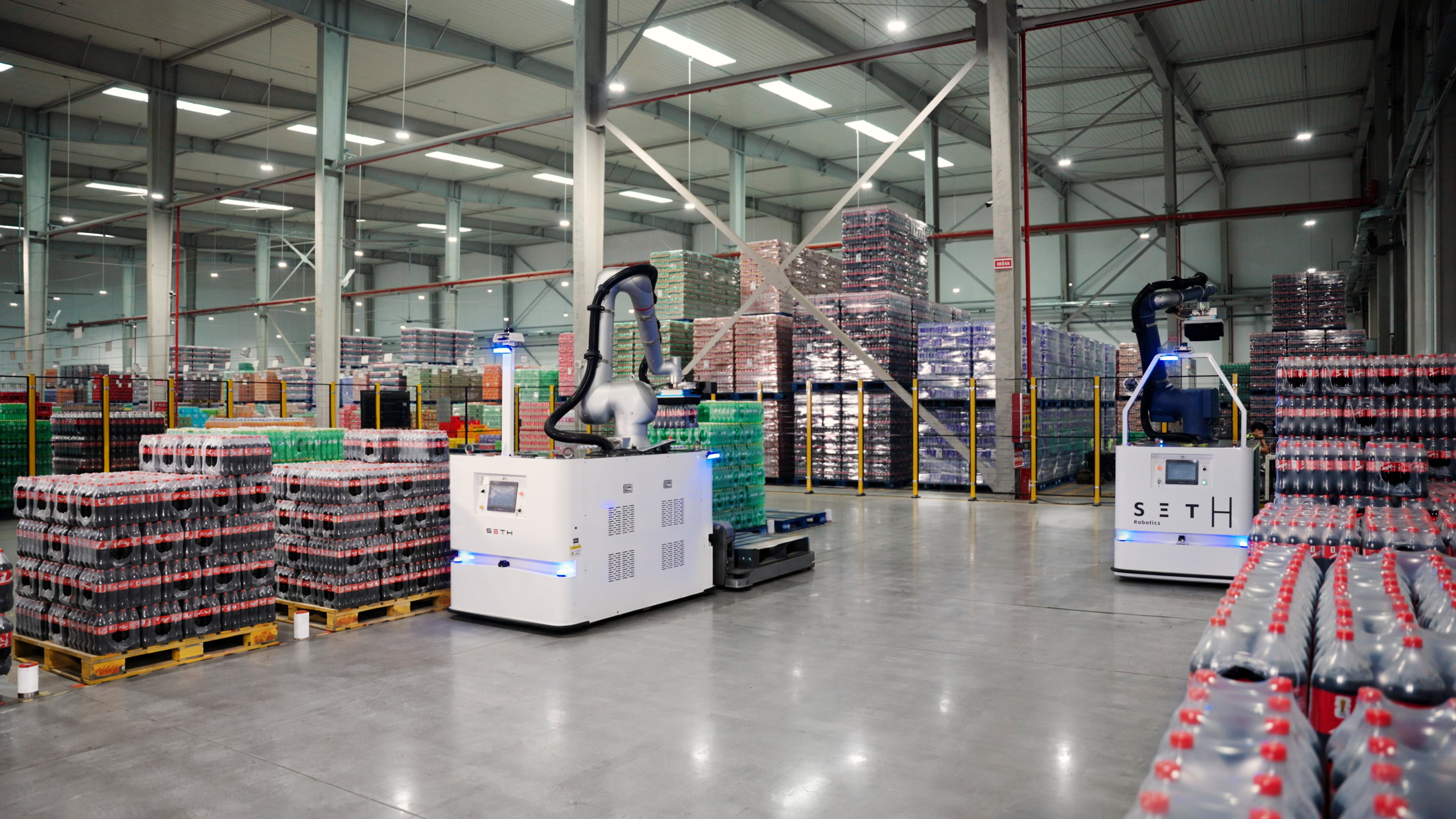 Robots developed by Hangzhou-based Seth Robotics picking goods at Swire Coca-Cola’s smart factory in Zhengzhou, Henan province, on Friday. Photo: Handout