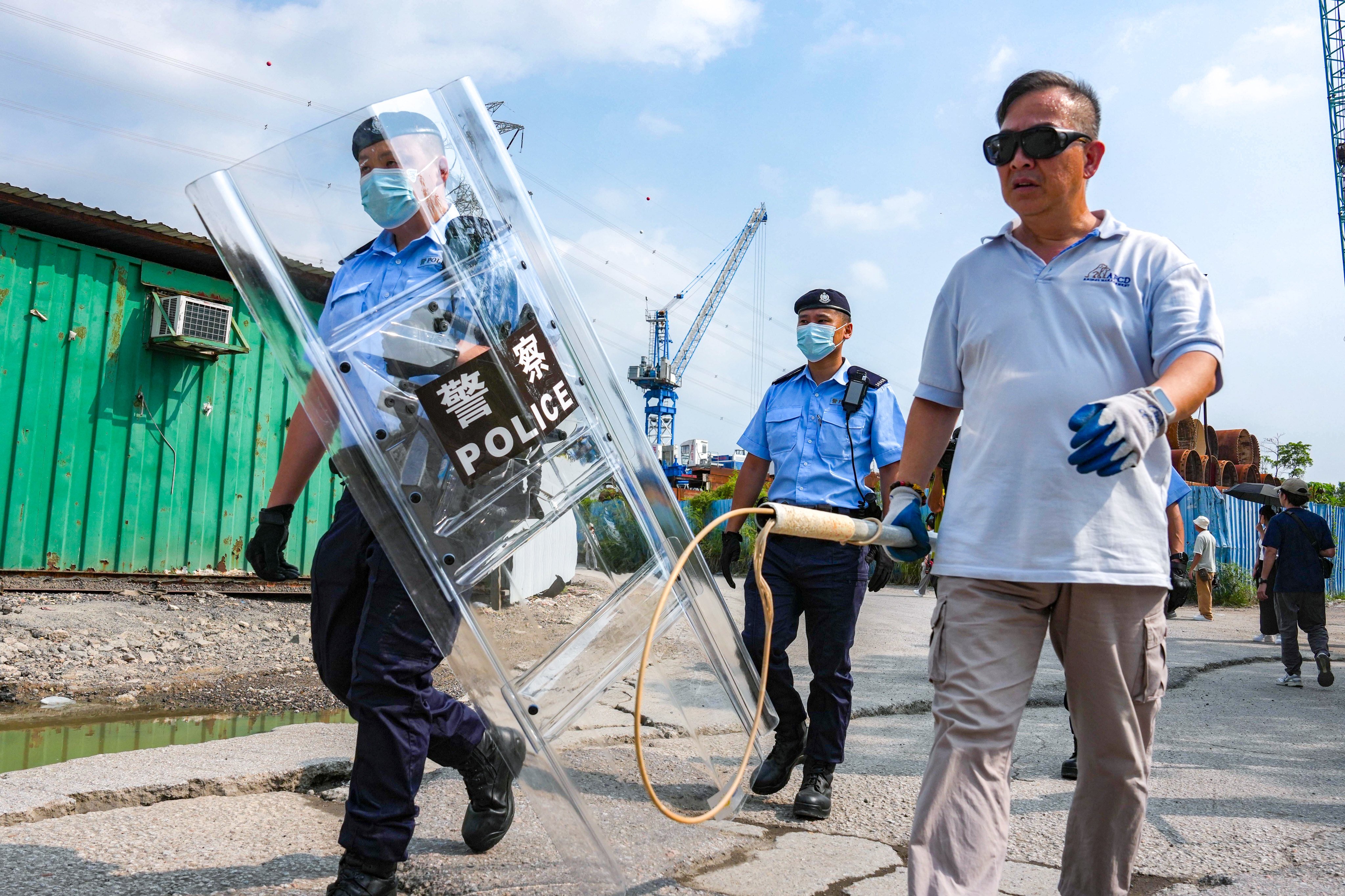 Hong Kong police and the Agriculture, Fisheries and Conservation Department conduct a joint operation to search for strays dogs and dangerous animals in the Pok Wai area in Yuen Long. Photo: Kit Lai