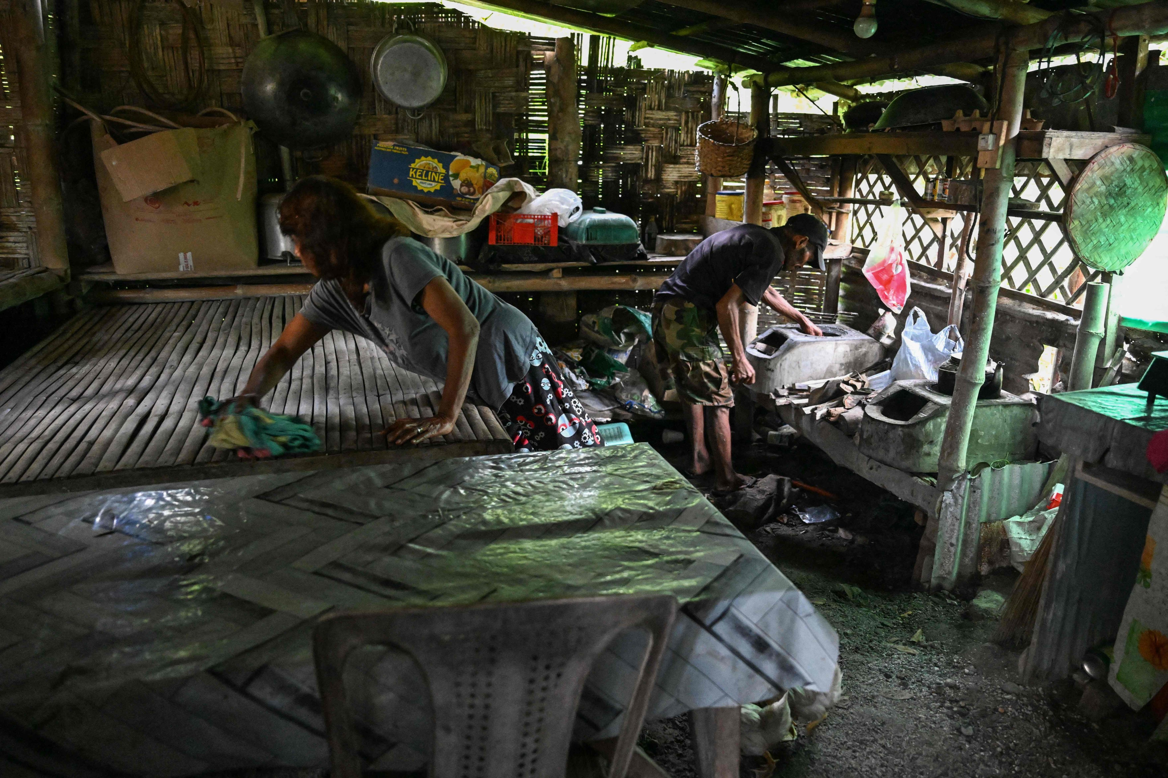 Tribal leader Petronila Munoz works inside her house in Capas, Tarlac province, on September 2. Photo: AFP