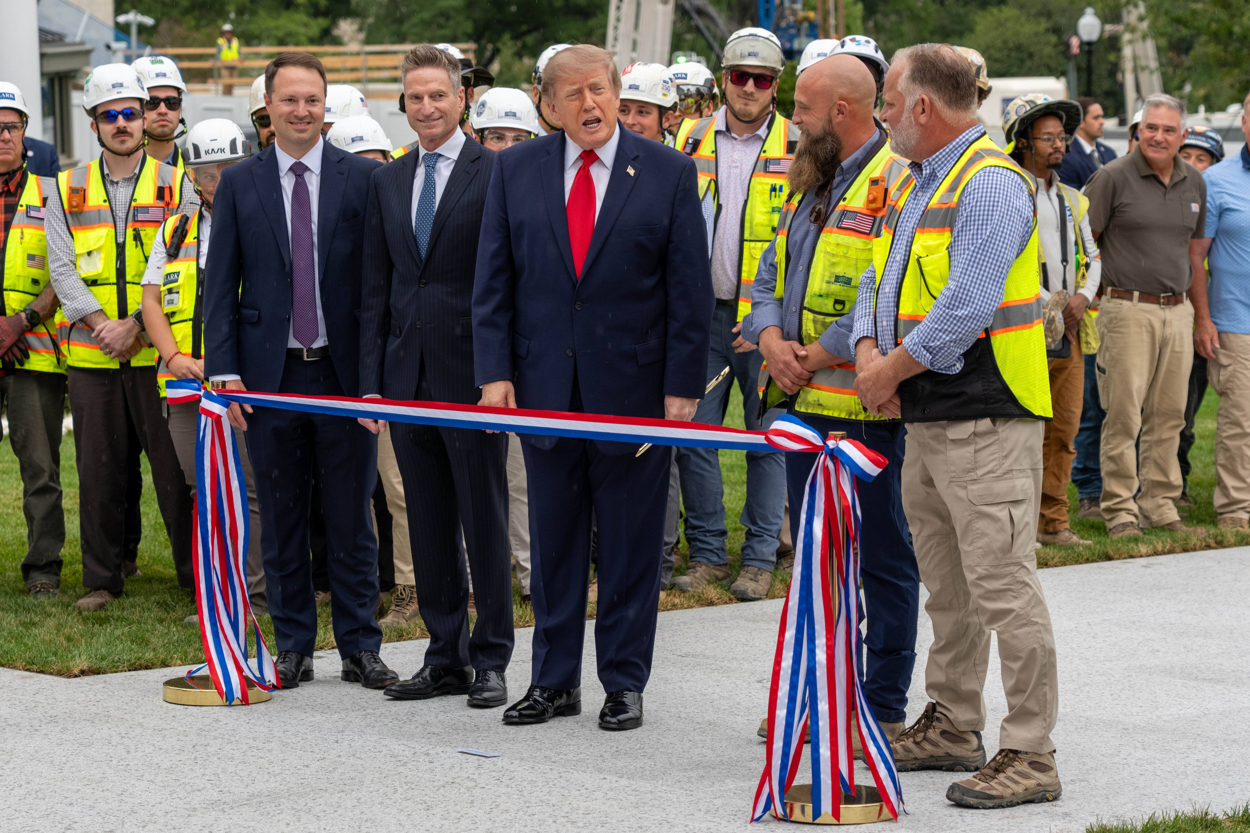 US President Donald Trump takes part in a ribbon-cutting ceremony for the new White House helipad on the South Lawn at the White House in Washington on Monday. Photo: Zuma Press Wire / dpa
