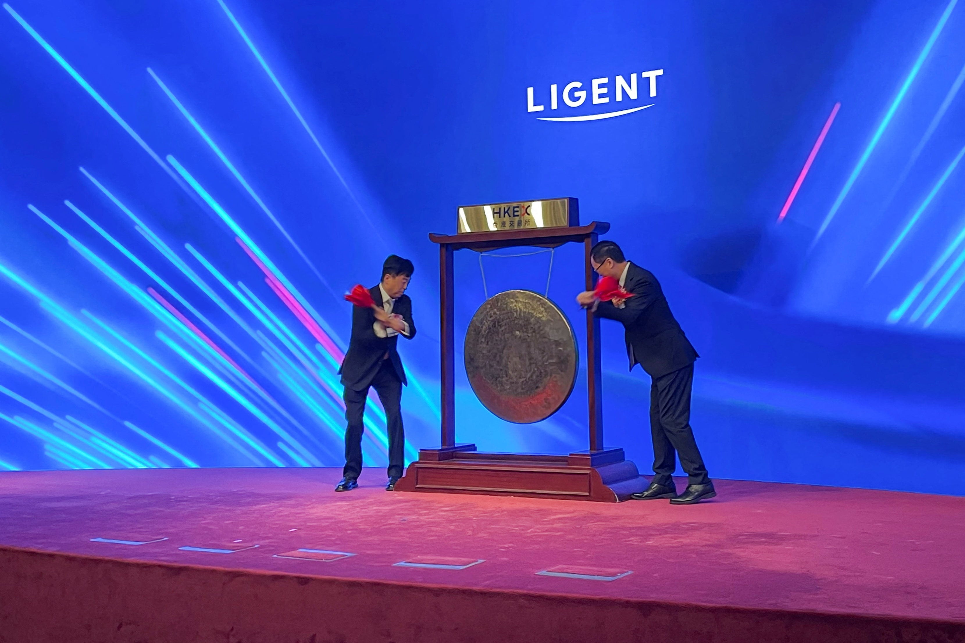 A gong-striking ceremony marks the trading debut of Ligent Technologies at the Hong Kong stock exchange on Tuesday. Photo: Reuters