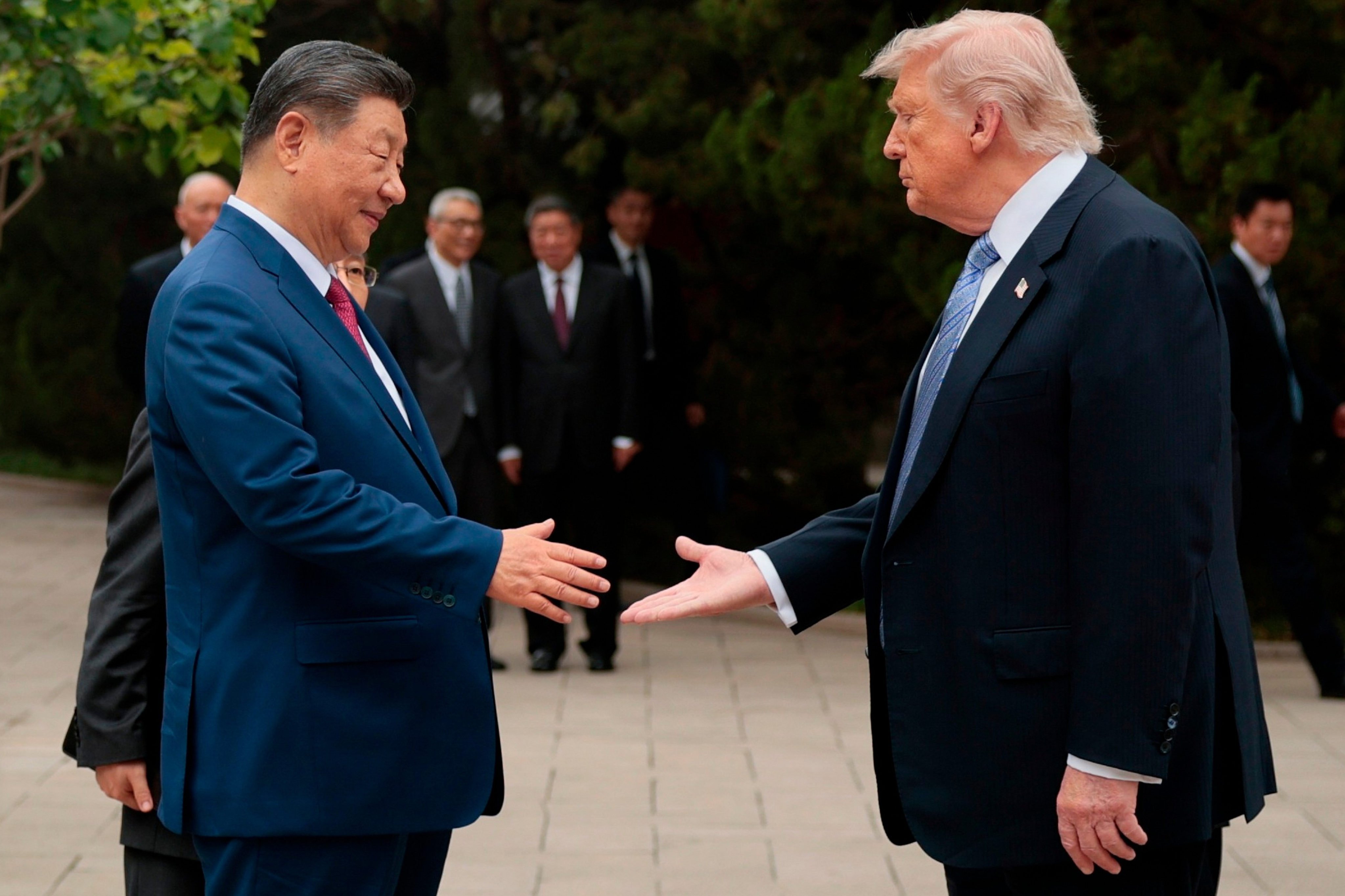 US President Donald Trump (right) shakes hands with Chinese President Xi Jinping while leaving after a visit to the Zhongnanhai Garden in Beijing, on May 15, 2026. The two leaders will meet in Washington this week. Photo: AP