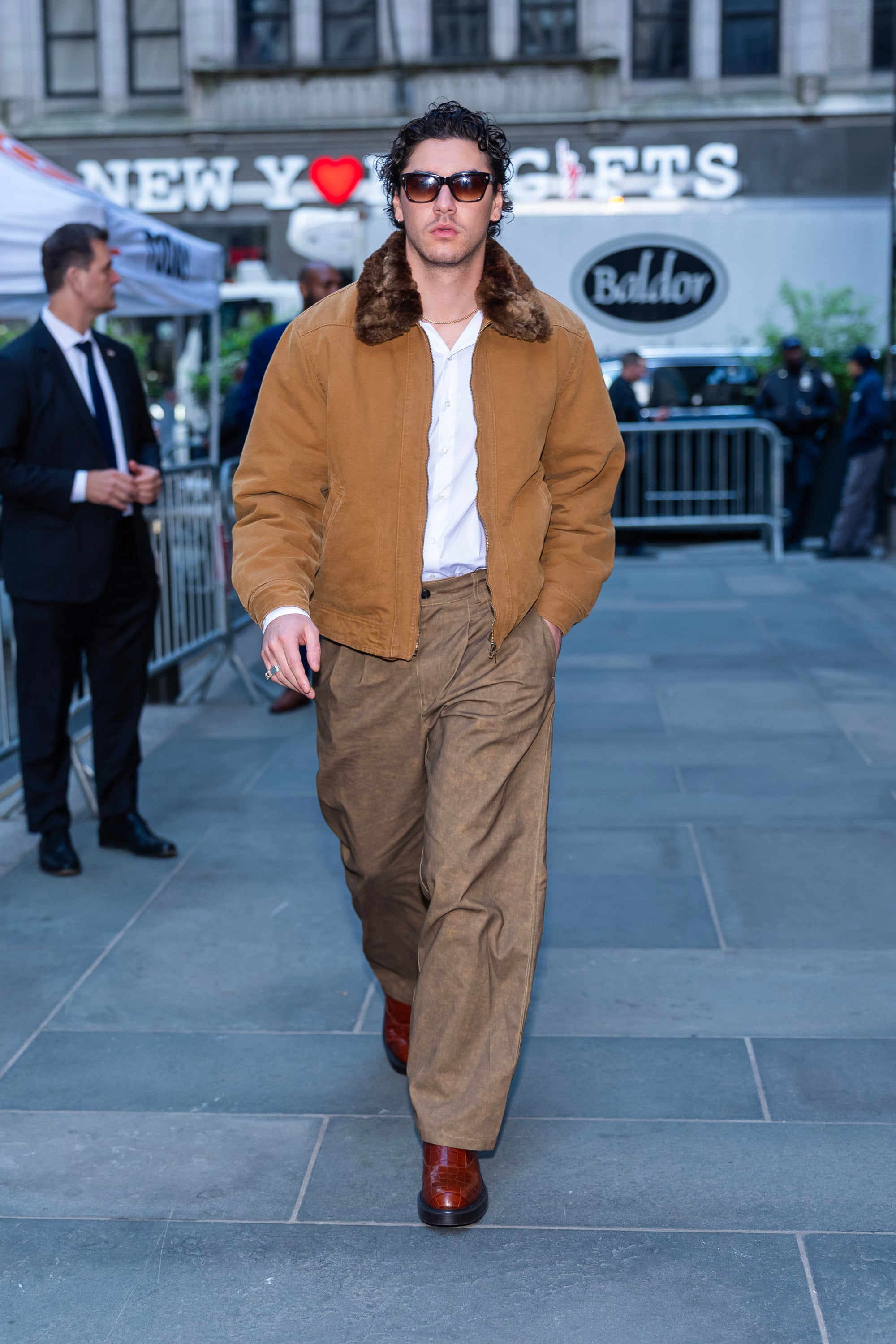 Belmont Cameli in New York City in May, wearing a fur-collar jacket and baggy trousers. Photo: Getty Images