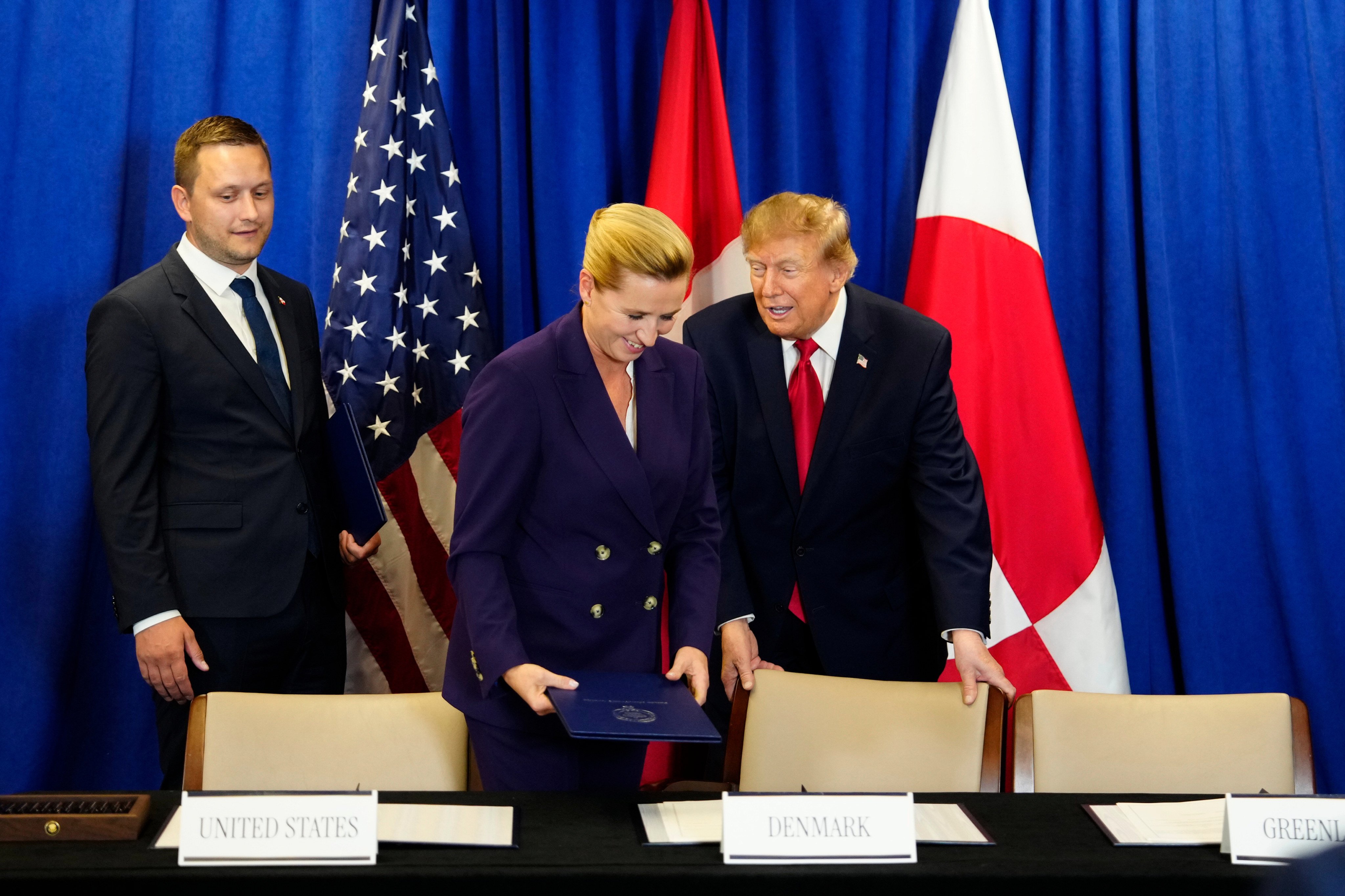 Denmark’s Prime Minister Mette Frederiksen, centre, Greenland’s Prime Minister Jens-Frederik Nielsen, left, and US President Donald Trump at the signing ceremony of a security deal between the US, Denmark and Greenland on Tuesday. Photo: AP