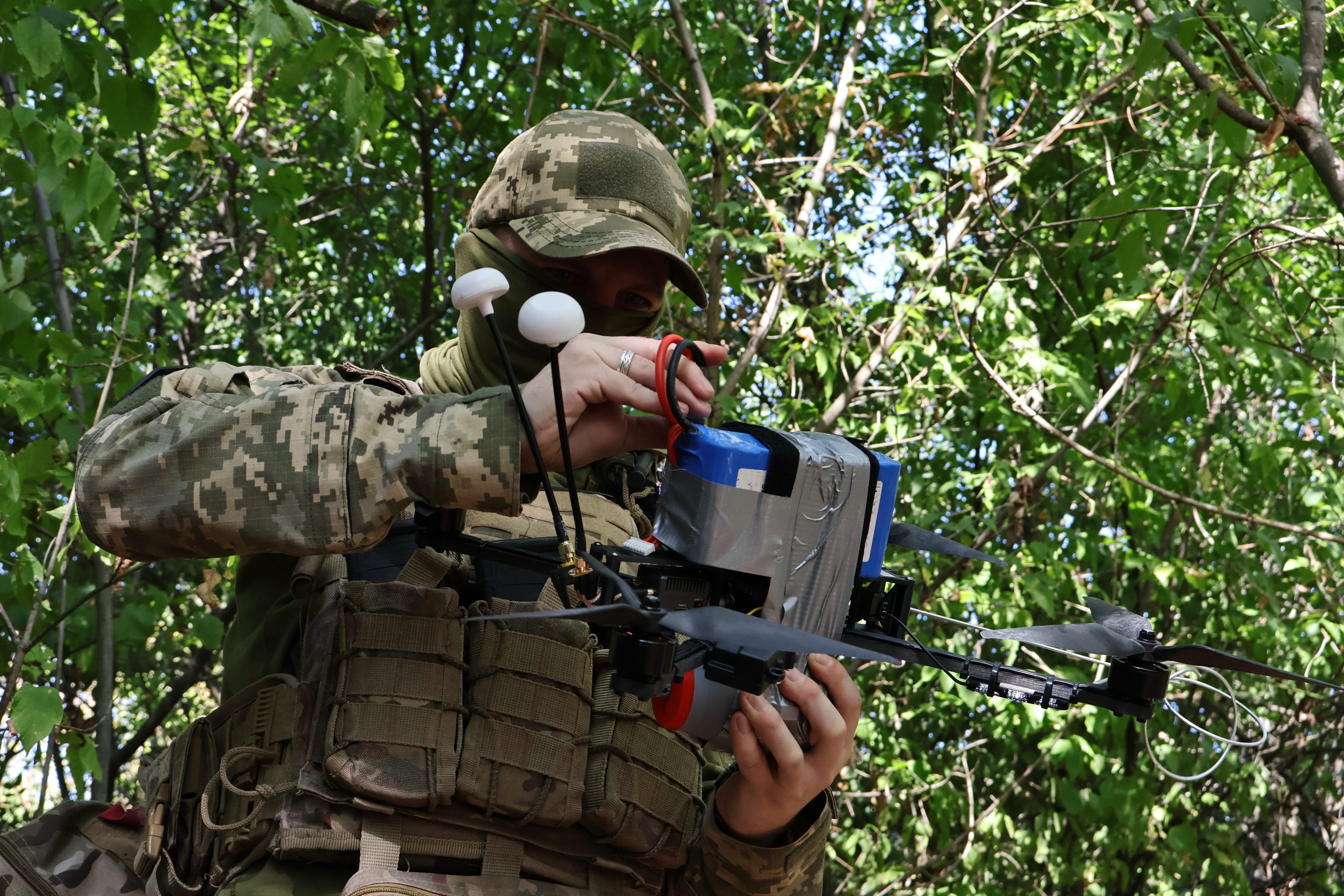 A Ukrainian soldier prepares a drone to fire towards Russian positions in the Zaporizhzhia region of Ukraine on Saturday. Photo: Ukraine’s 65th Mechanised Brigade via AP
