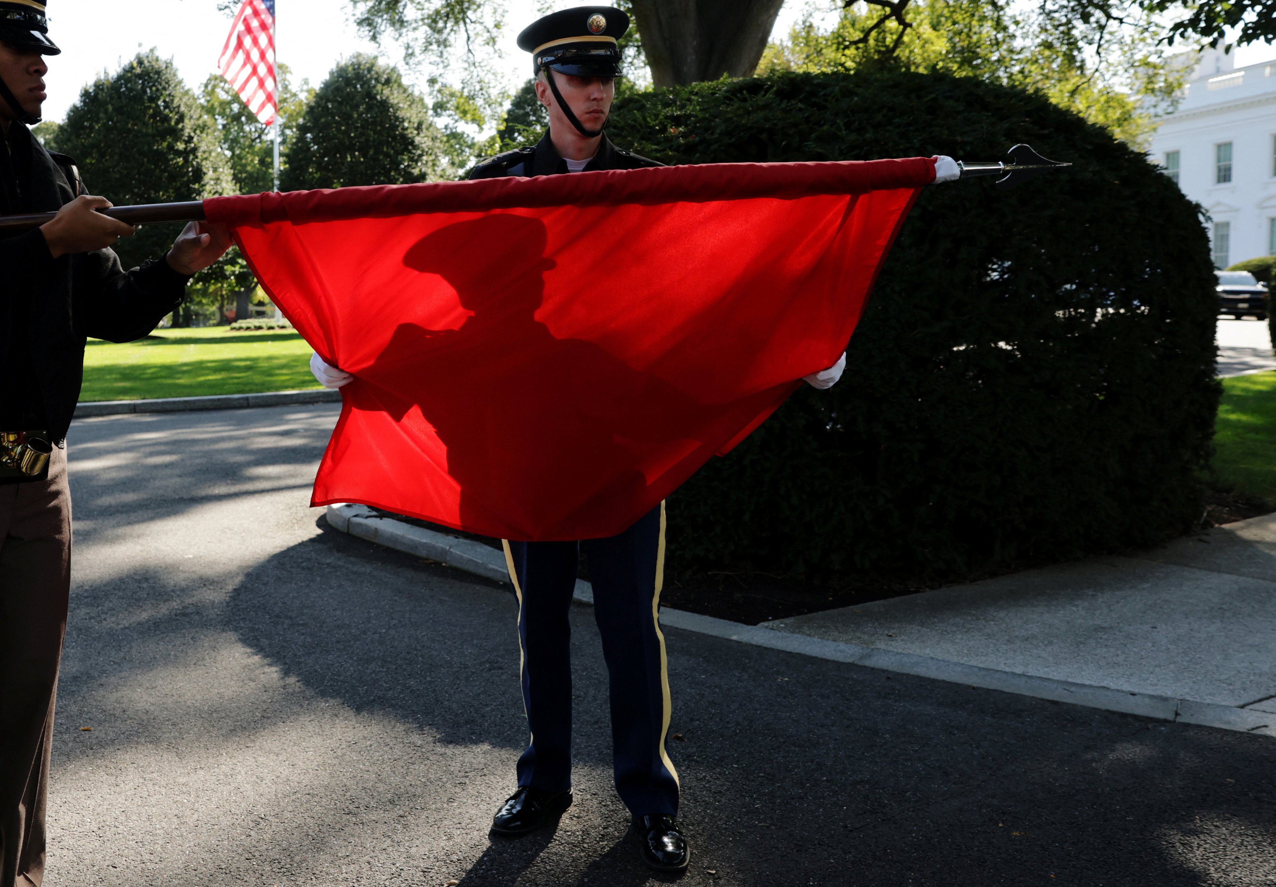 Members of a US military honour guard roll up a Chinese flag in Washington after rehearsing for Chinese President Xi Jinping’s state visit this week. Photo: Reuters