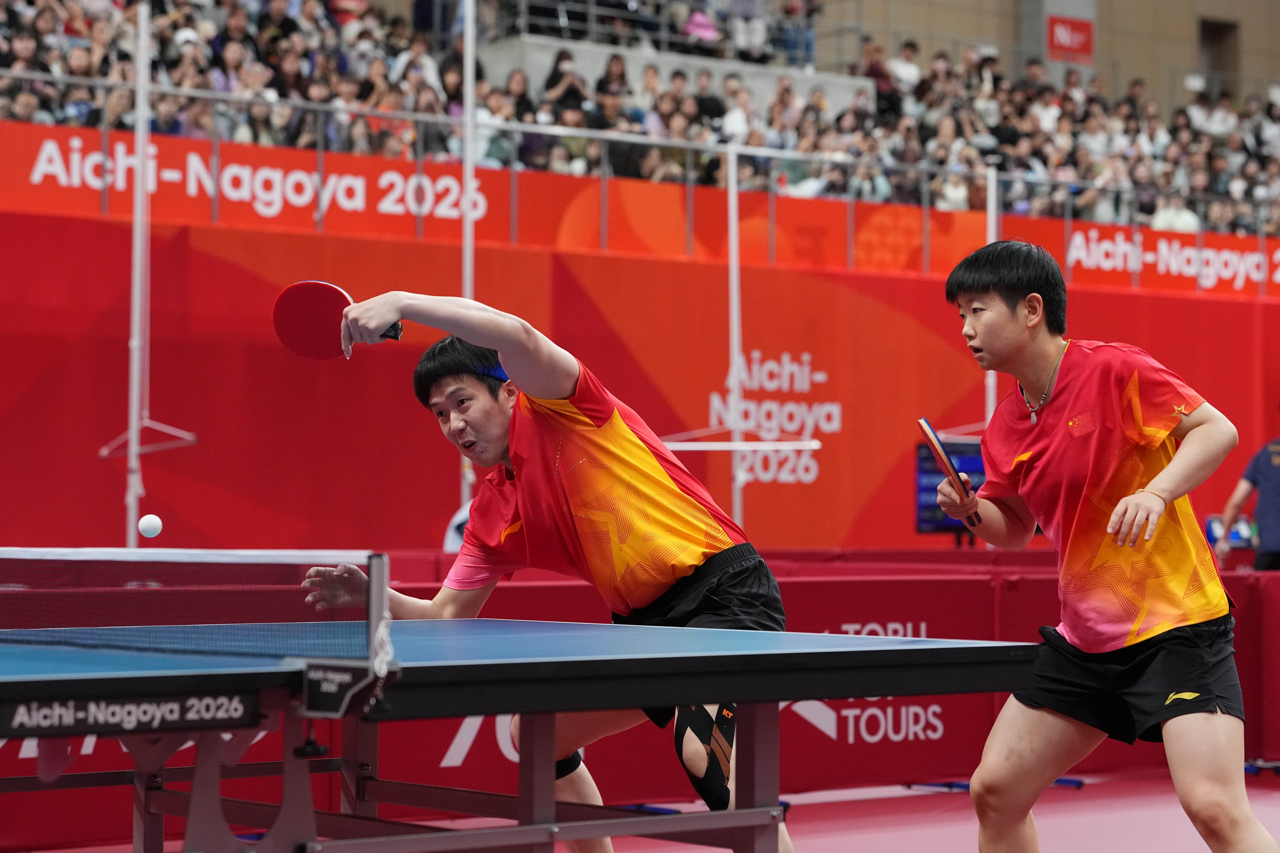 Wang Chuqin (left) and Sun Yingsha beat Shokhrukh Iskandarov and Arujan Kamalova of Uzbekistan in the mixed doubles round of 32 at the Asian Games. Photo: Xinhua