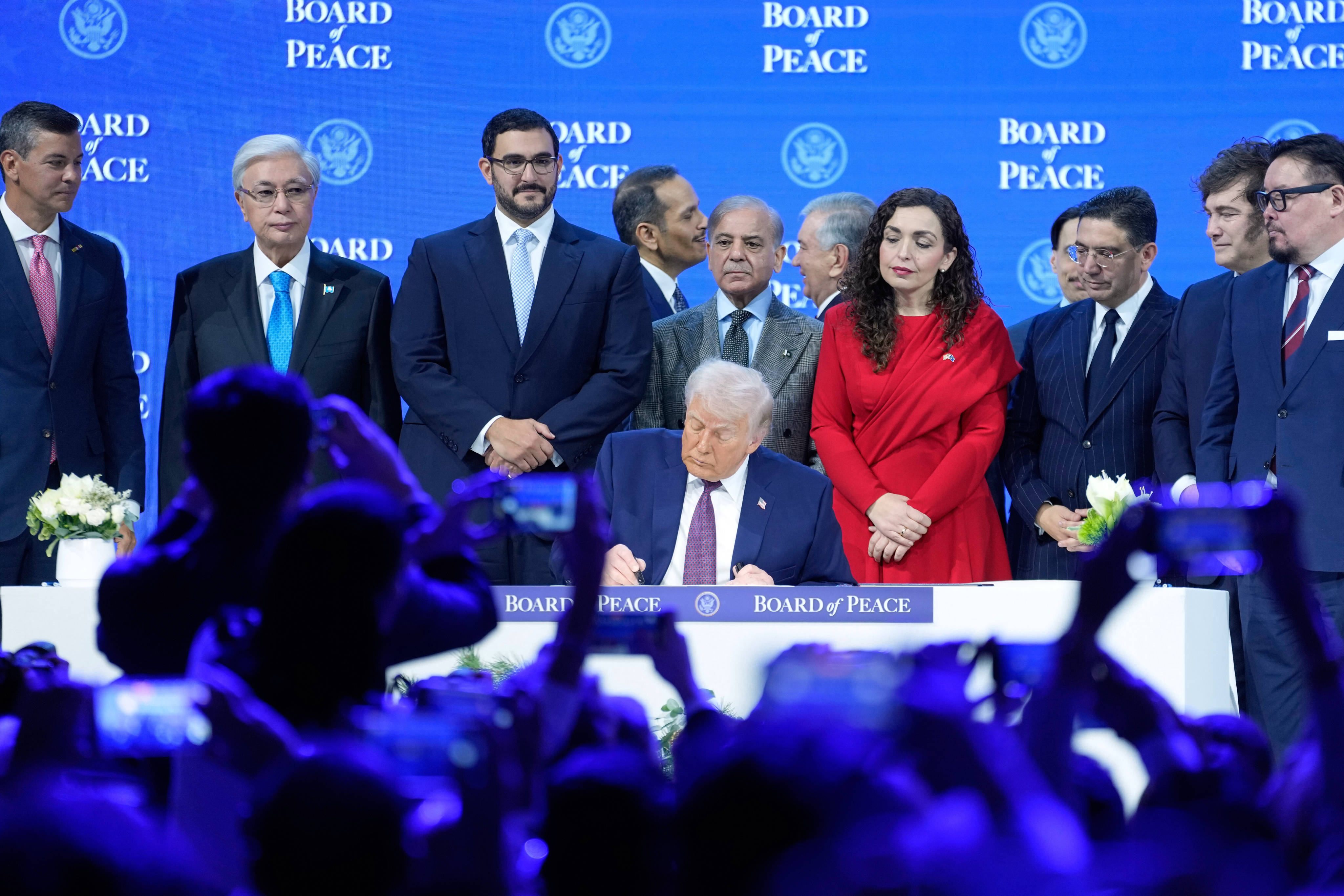 US President Donald Trump signs the charter of his Board of Peace initiative at the Annual Meeting of the World Economic Forum in Davos, Switzerland in January. Photo: AP