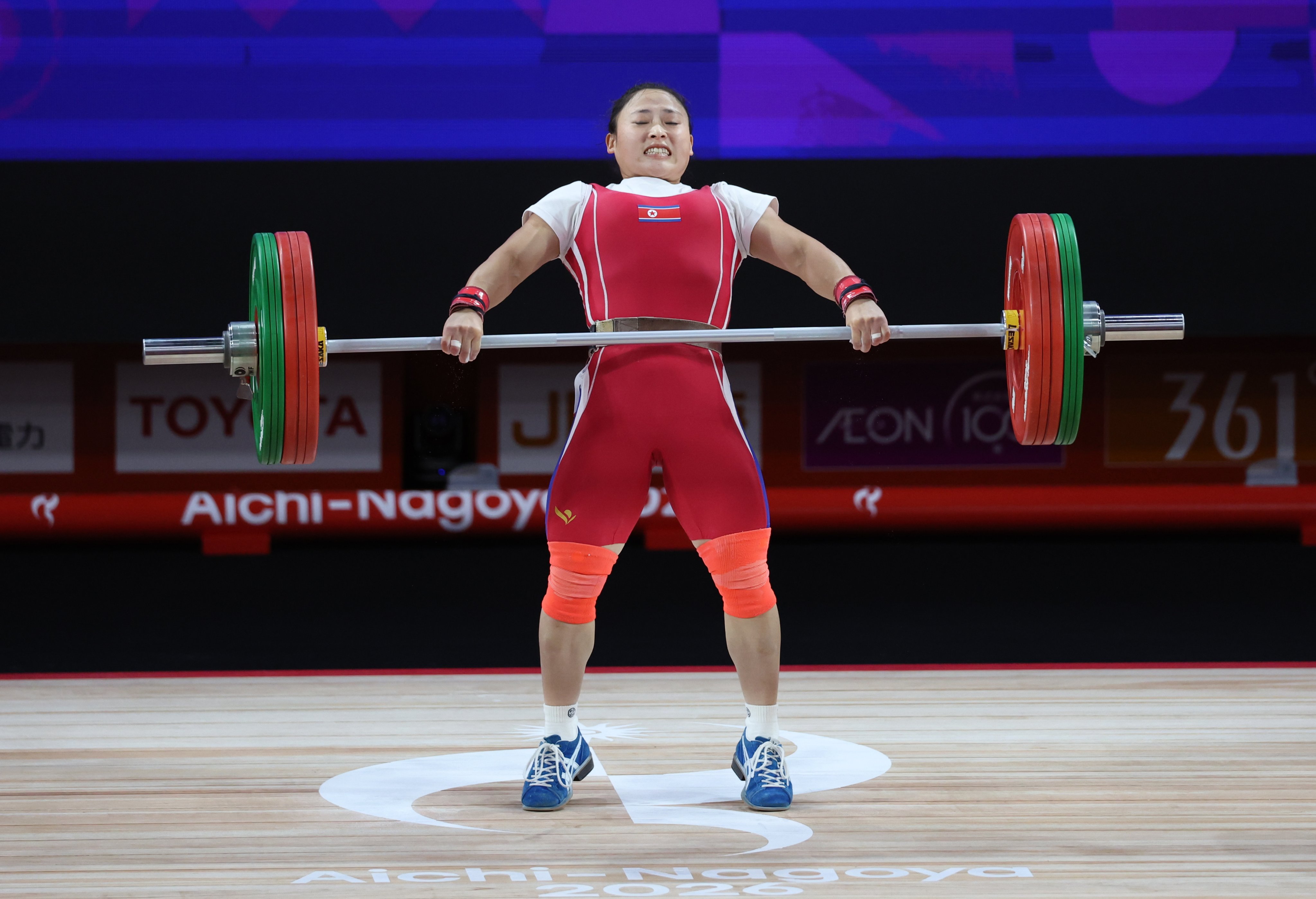North Korean Ri Song-gum set the world records in the women’s 49kg class, joining an elite club of just four weightlifters who have won three Asian Games gold medals. Photo: EPA