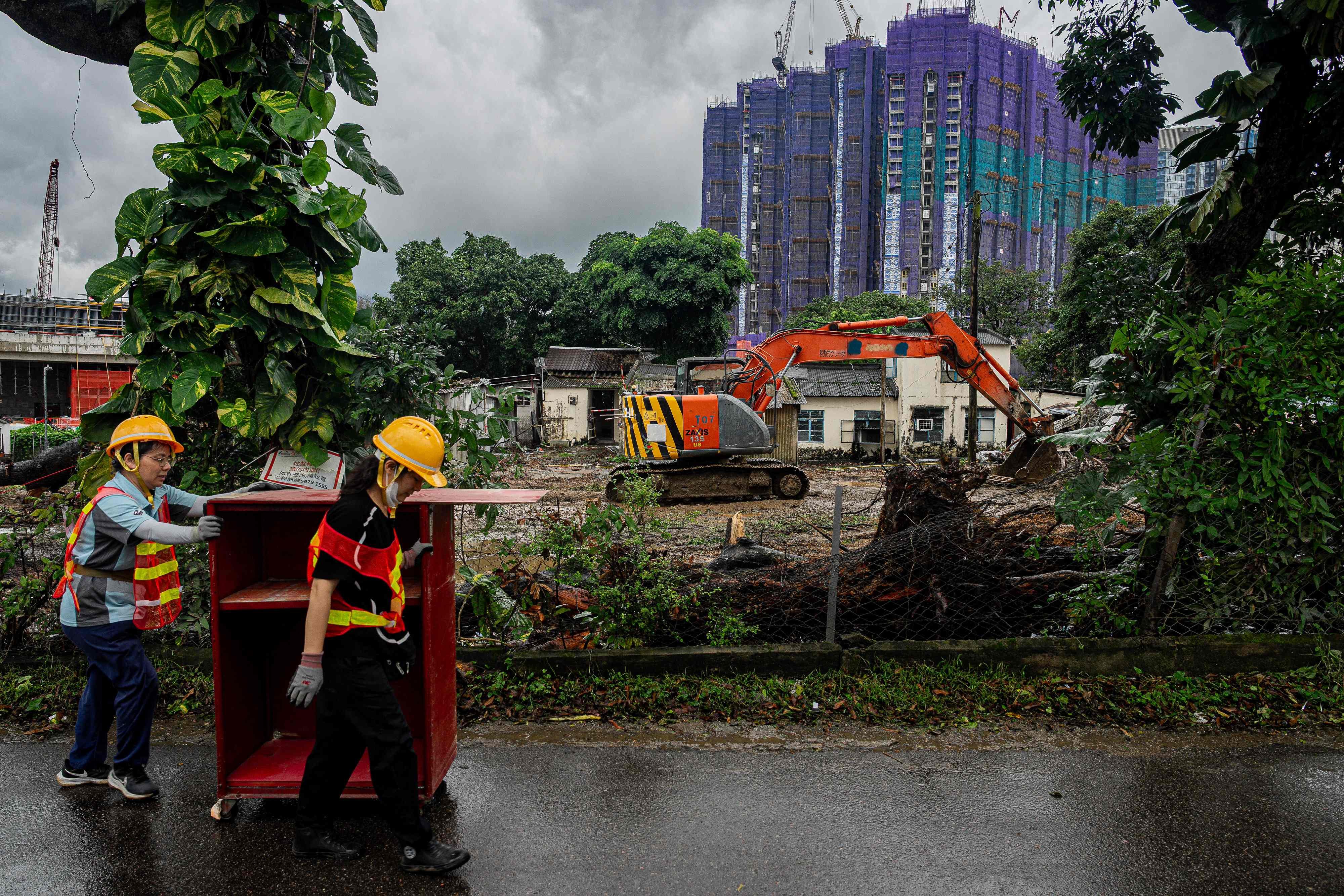 Workers remove belongings from a demolition site in Kwu Tung on June 17 to make way for developments under the the Northern Metropolis plan. Urban policy research can bring future and existing residents’ expectations into planning and identify problems while there is still time to change course. Photo: AFP