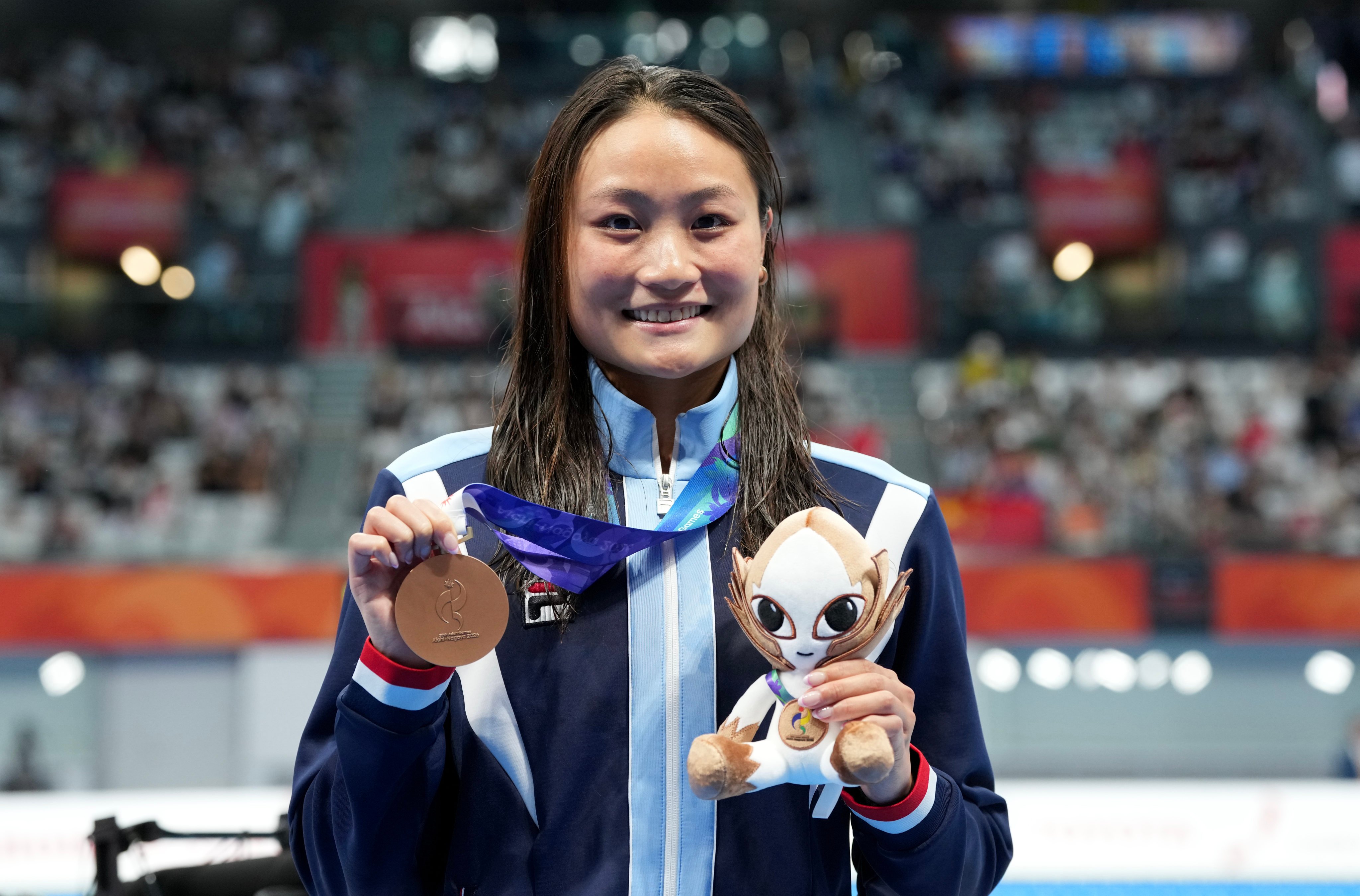 Hong Kong’s Natalie Kan wins bronze in the women’s 100m butterfly at the Asian Games. Photo: Robert Ng