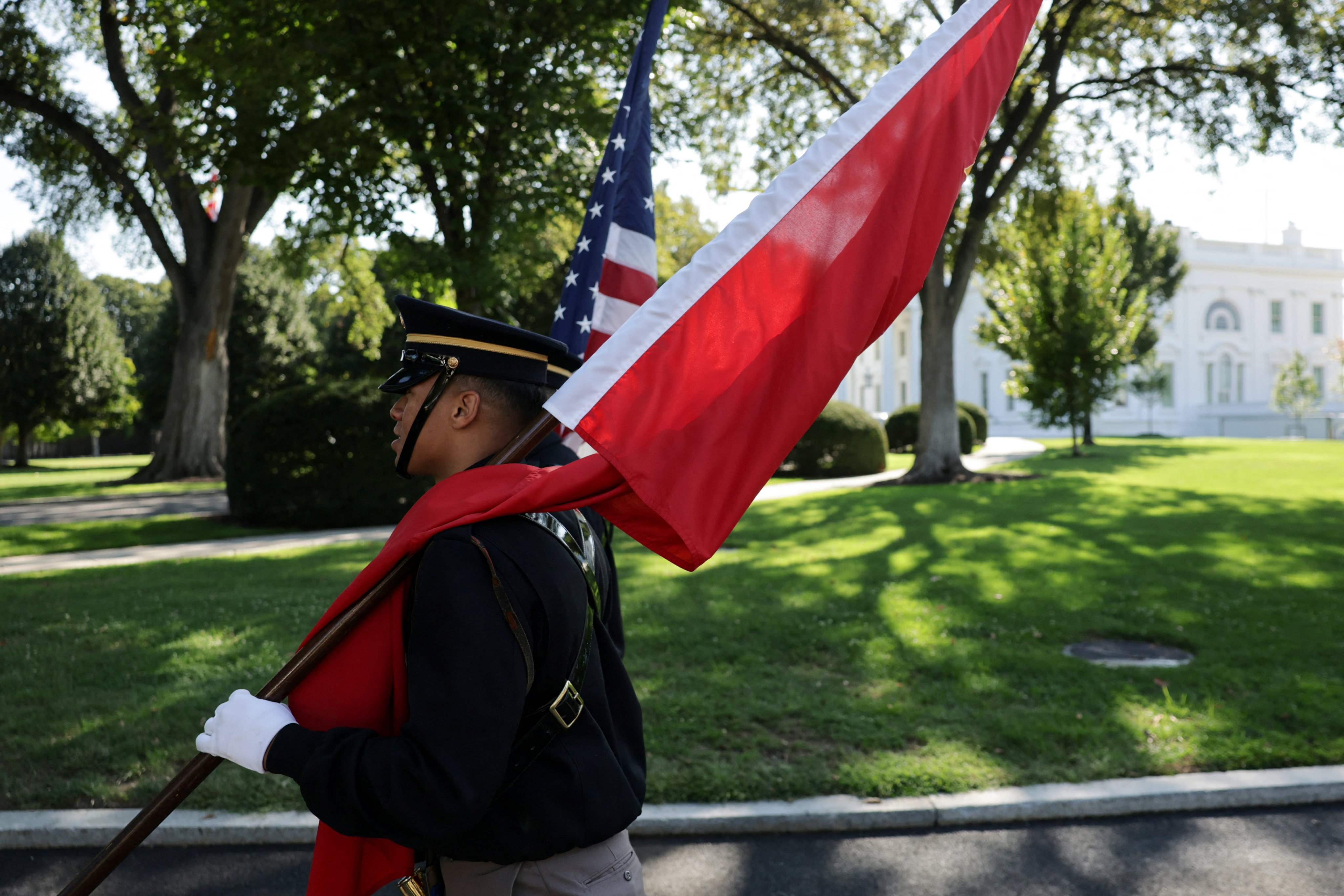 A military honour guard rehearses with the US and Chinese flags  at the White House in preparation for Chinese President Xi Jinping’s state visit. Photo: Reuters