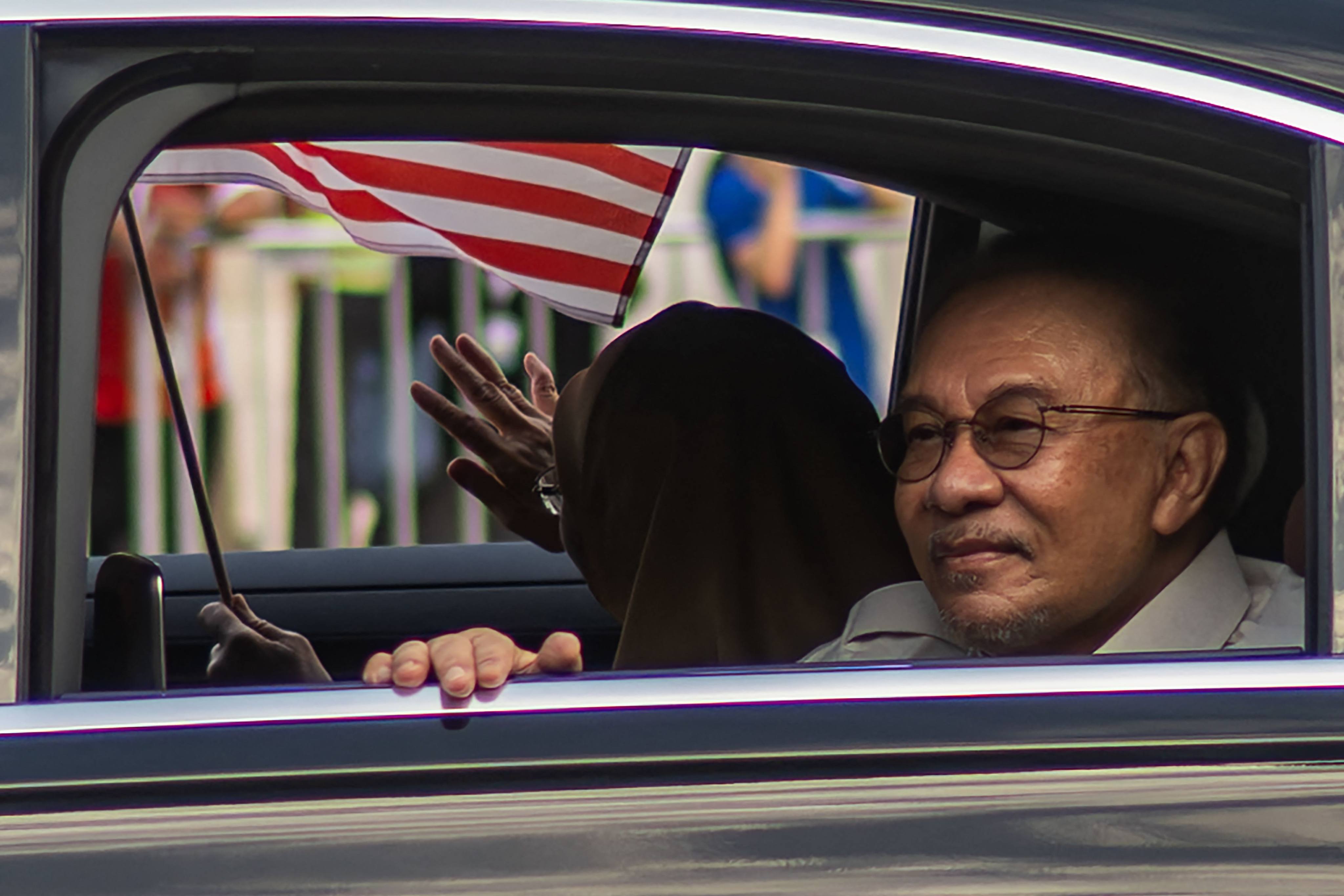 Malaysias Prime Minister Anwar Ibrahim and his wife arrive for National Day celebrations in Malaysia’s administrative capital Putrajaya last month. Photo: AFP