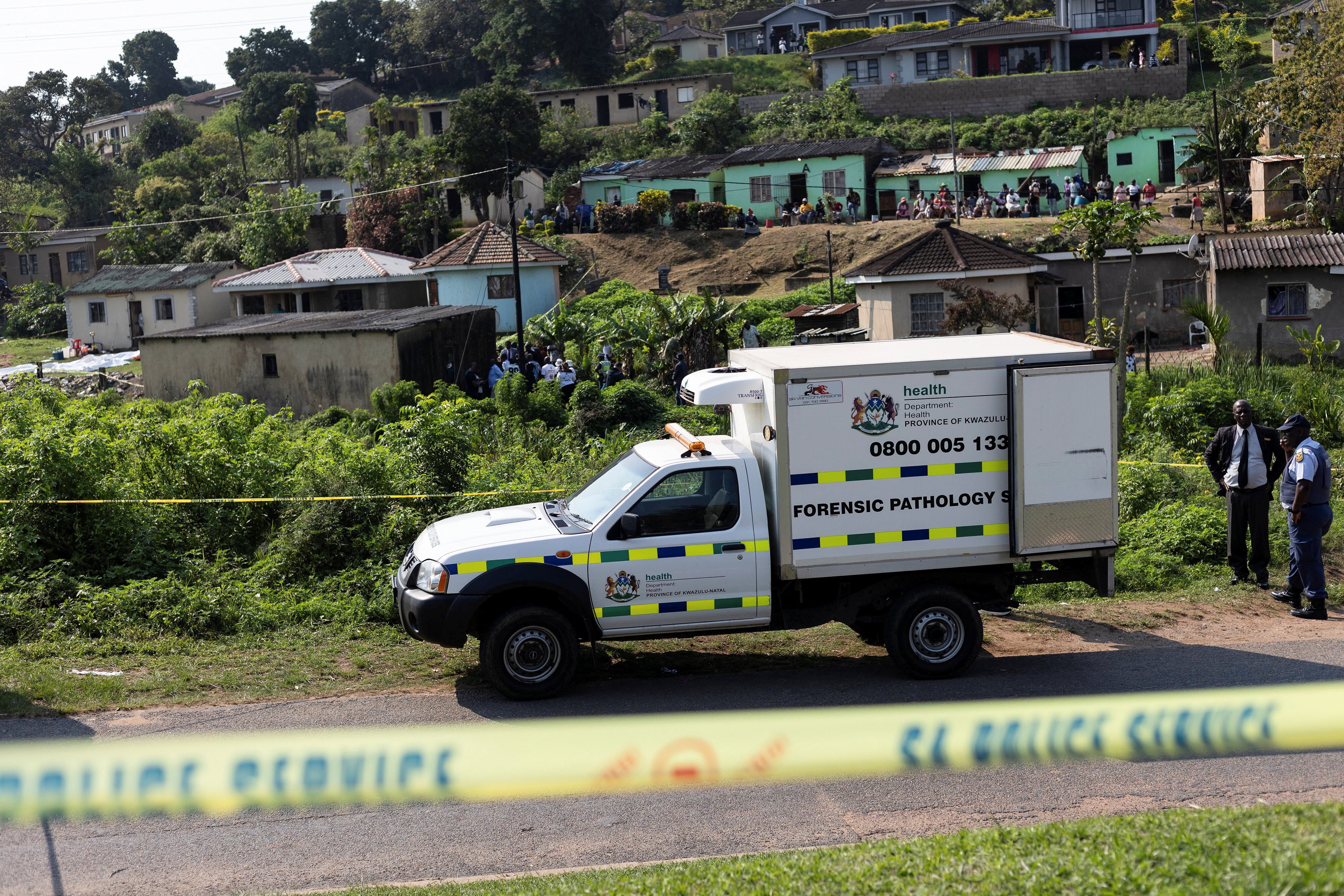 A forensic vehicle is parked near the scene where several people were killed and several others injured, in the township of KwaMakhutha near Durban, South Africa, on Wednesday. Photo: Reuters