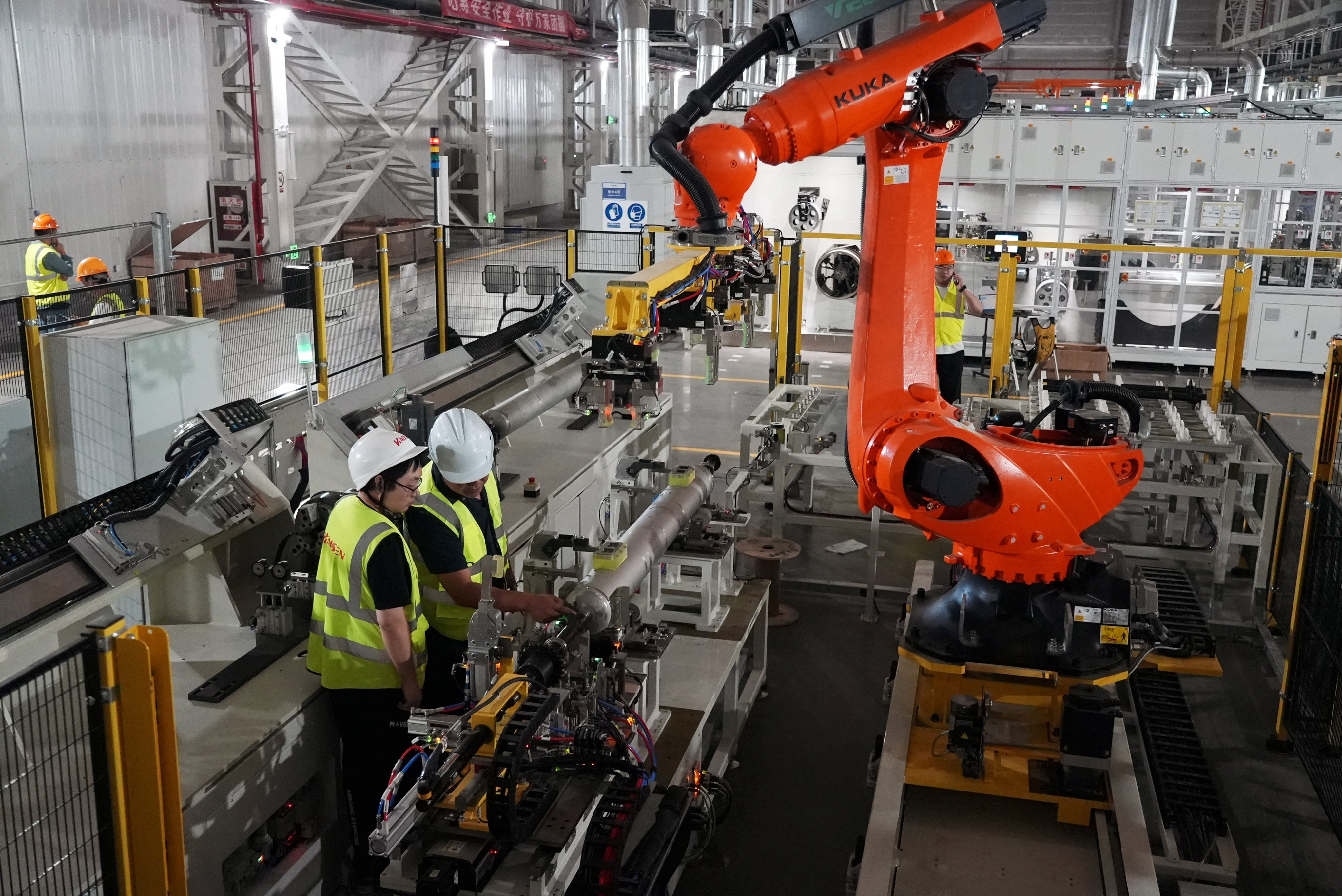 Employees inspect equipment on the production line before the official opening of U.S. battery company EnerVenue's new factory in Changzhou, Jiangsu province, China September 18, 2026. REUTERS/Nicoco Chan