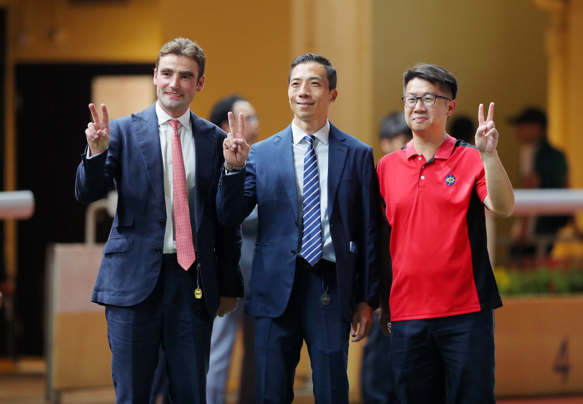 David Eustace (left) laps up his Happy Valley double with stable staff.