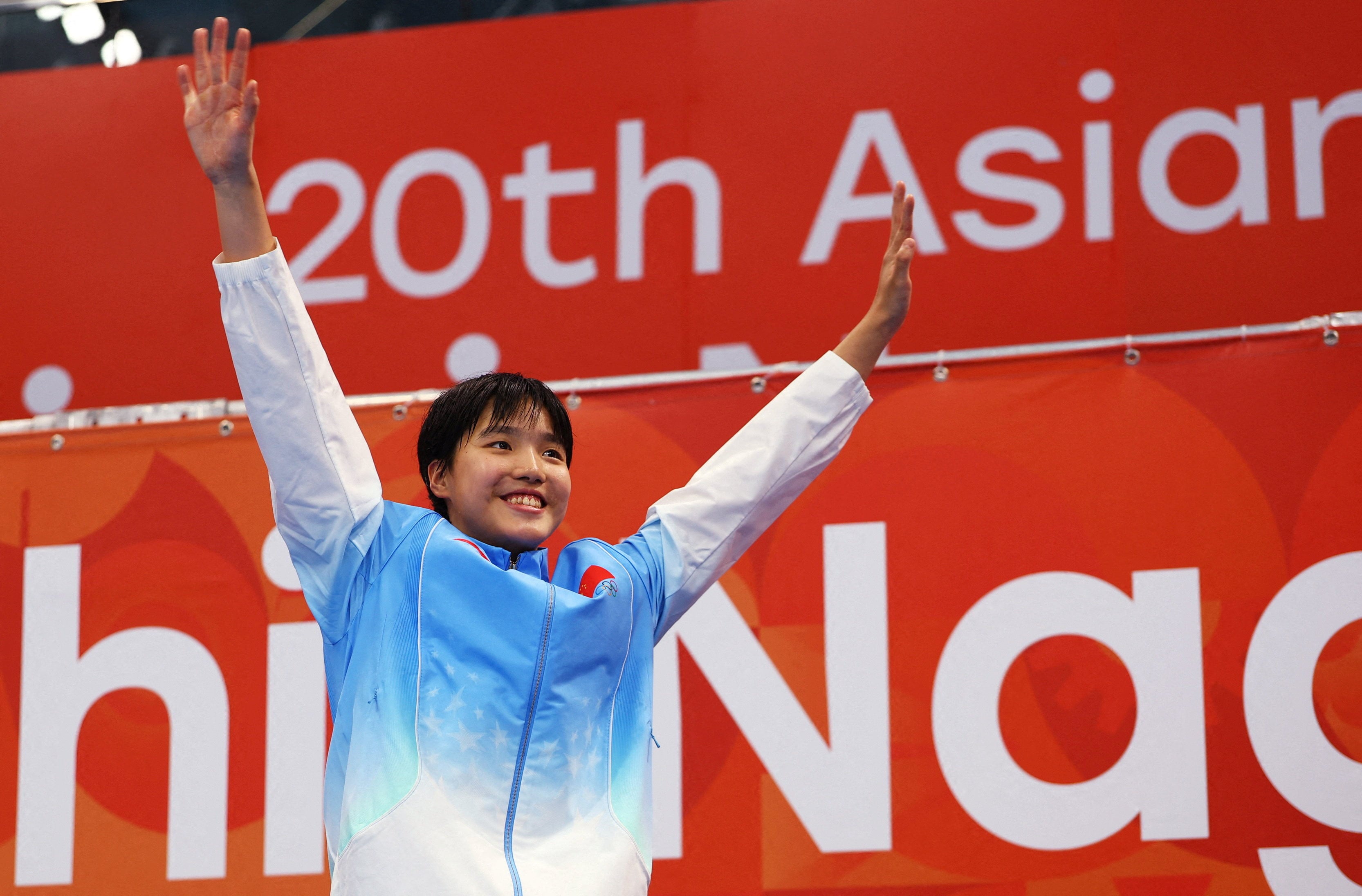 China’s Zidi Yu celebrates on the podium after winning the 400m individual medley final in Tokyo on Wednesday. Photo: Reuters