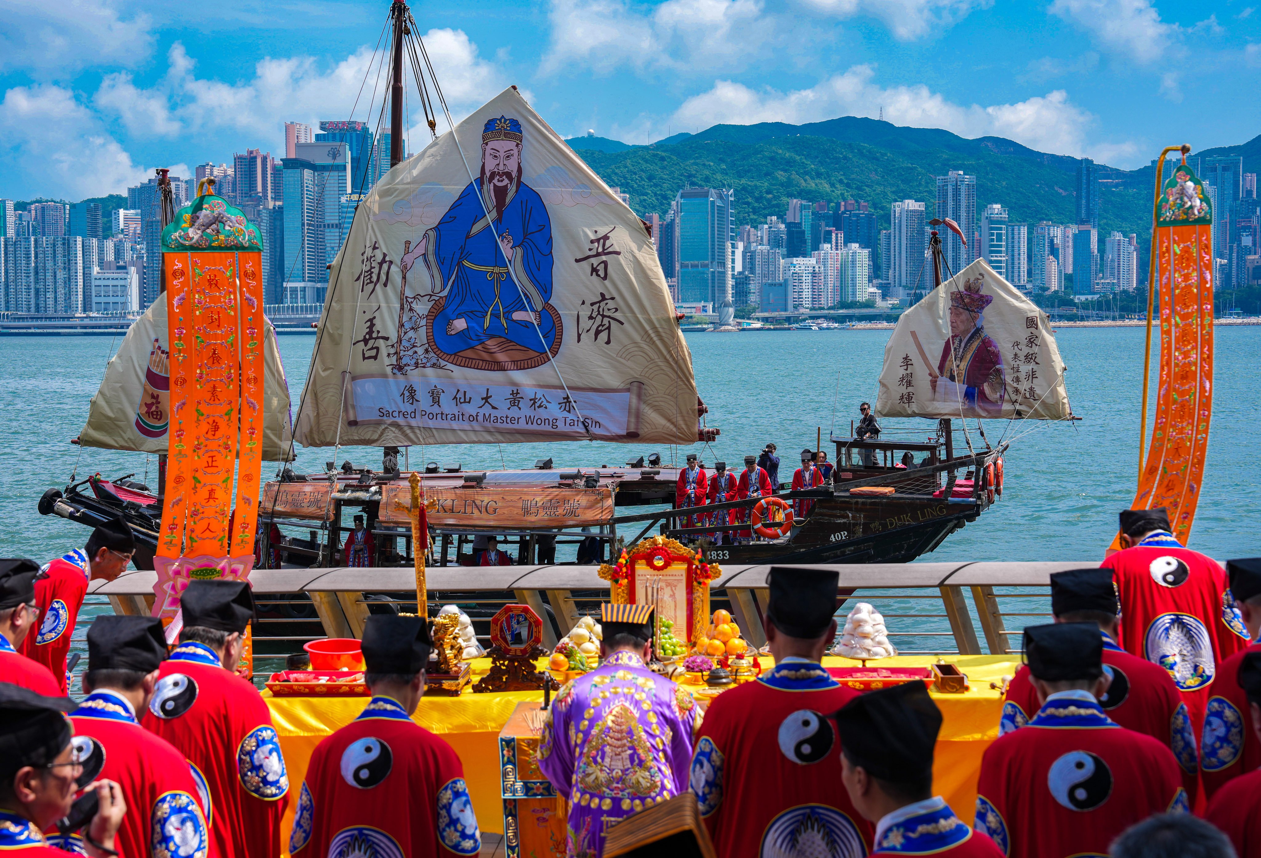 The historic Chinese junk ‘Dukling’ sails across Victoria Harbour, displaying a 70-square-metre portrait of Wong Tai Sin on its mainsail to mark the deity’s birthday. Photo: Kit Lai