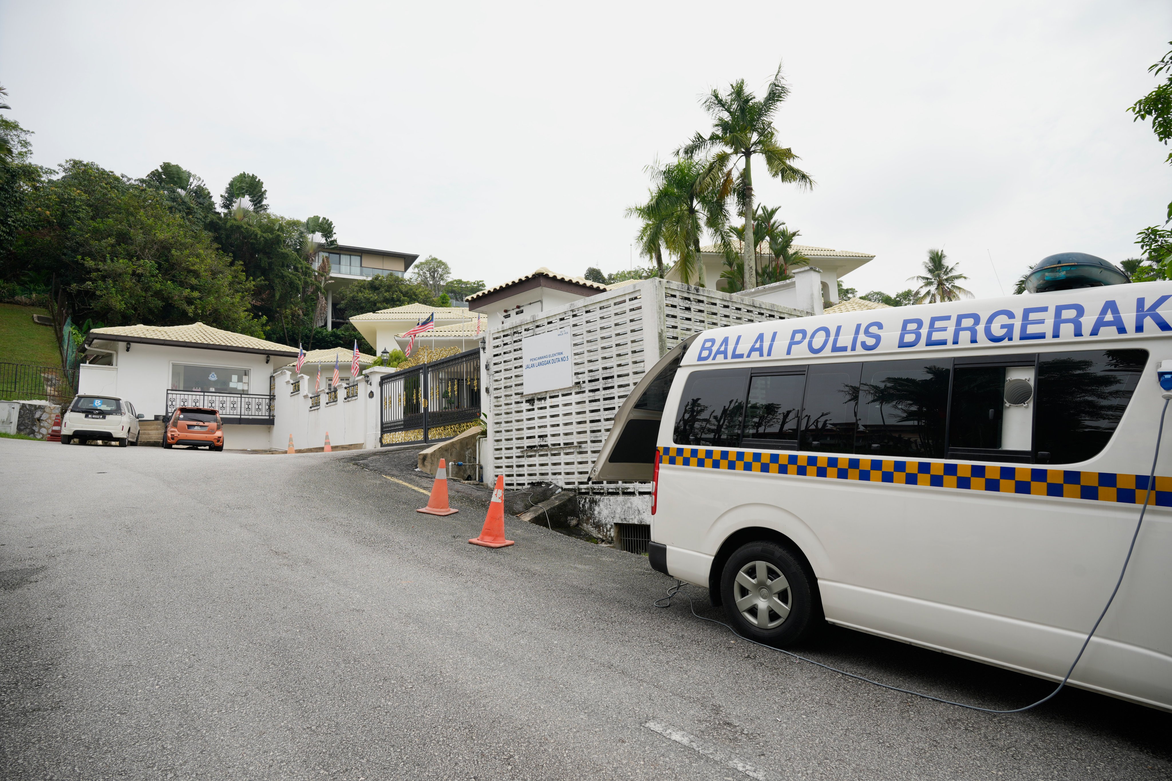 A mobile police station is stationed outside the residence of former Malaysian Prime Minister Najib Razak where he is expected to serve the rest of his prison term under house arrest in Kuala Lumpur. Photo: AP