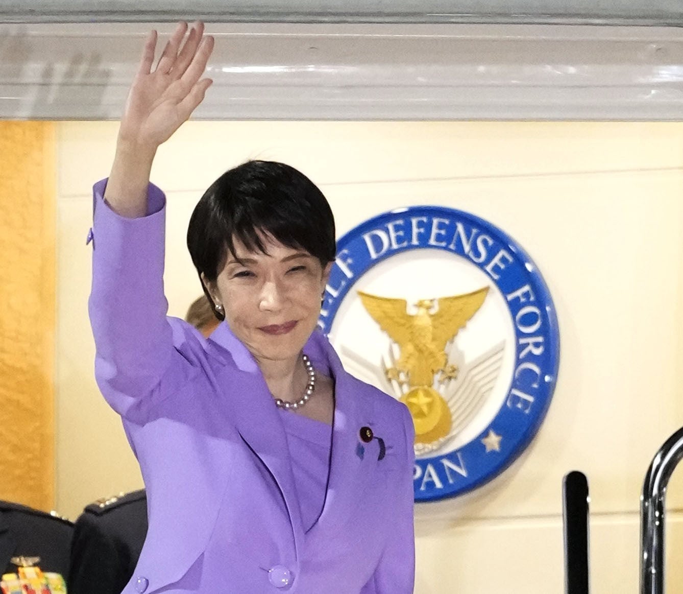 Japanese Prime Minister Sanae Takaichi waves before leaving Tokyo’s Haneda Airport aboard a government plane on September 21, on her way to the UN General Assembly in New York. Photo: Kyodo