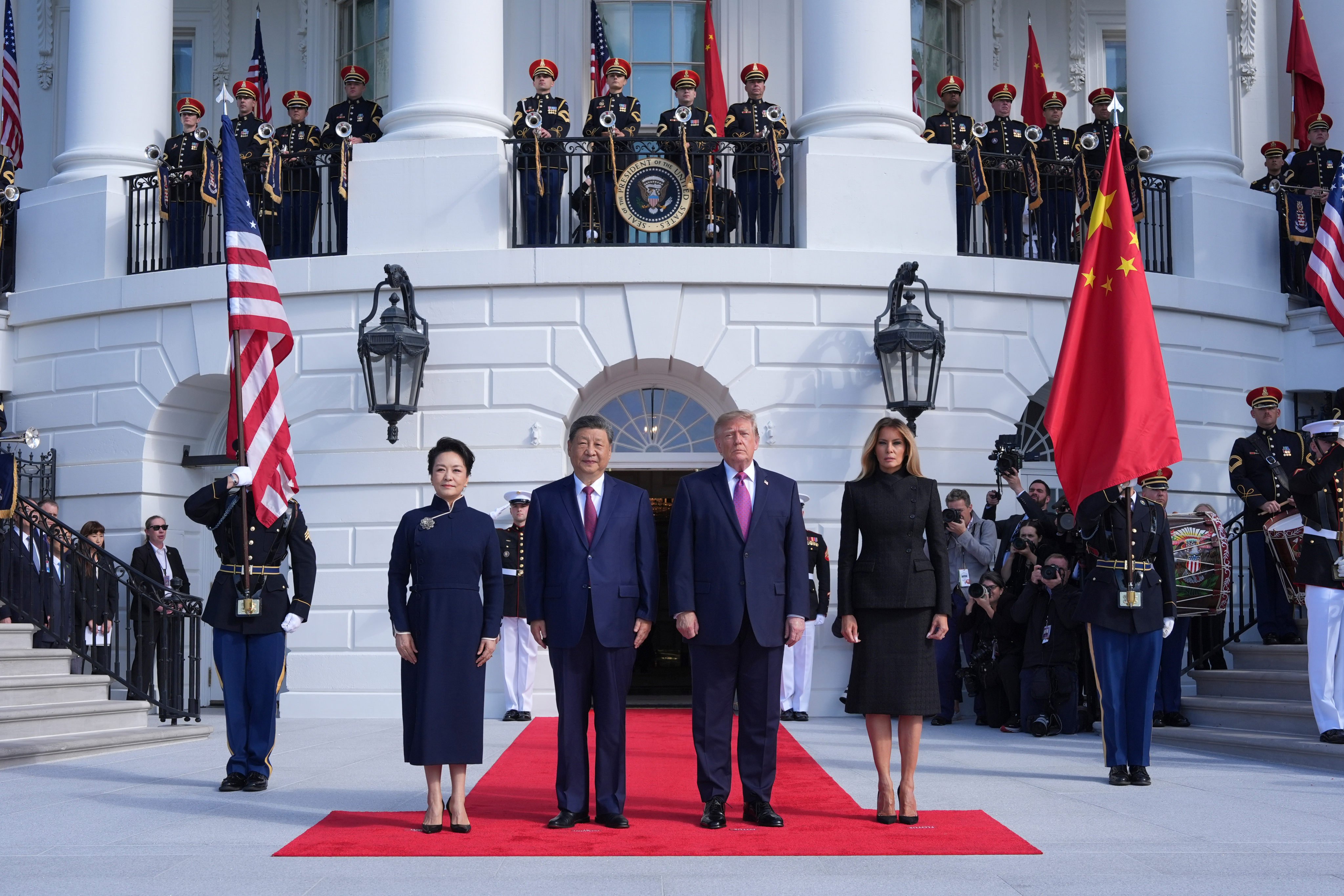 US  President Donald Trump (centre right) and first lady Melania Trump (right) greet Chinese President Xi Jinping (centre left) and his wife Peng Liyuan on the South Portico of the White House in Washington on Thursday. Photo: AP