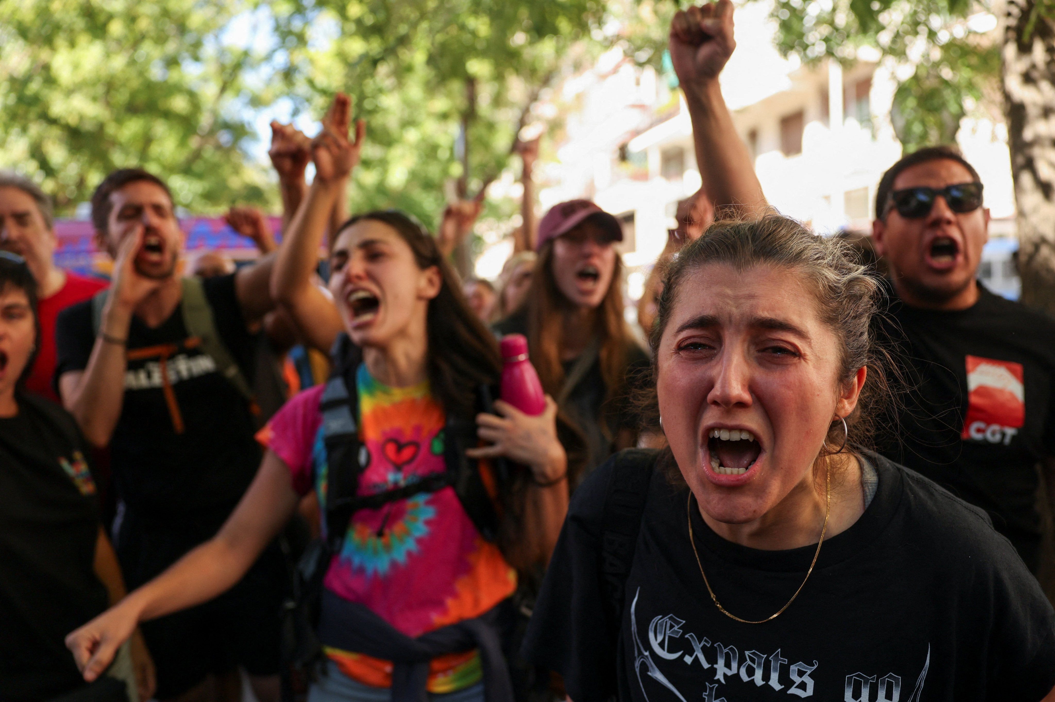 Housing activists react on Wednesday after Maricarmen Abascal, 87, was taken away on a stretcher to an ambulance, following her eviction from her Madrid home. Photo: Reuters