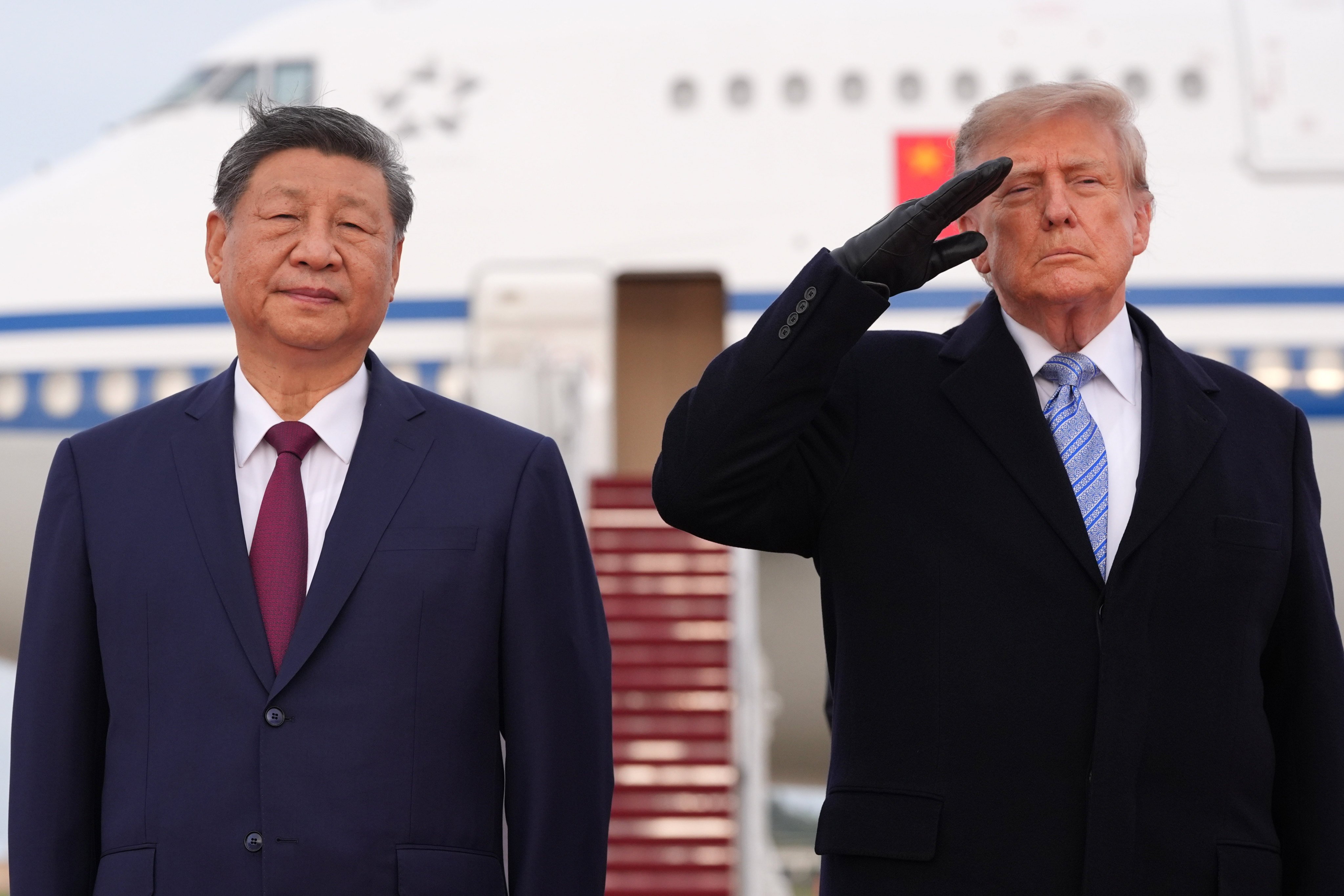 US President Donald Trump and Chinese President Xi Jinping participate in an arrival ceremony at Joint Base Andrews, Maryland. Photo: AP