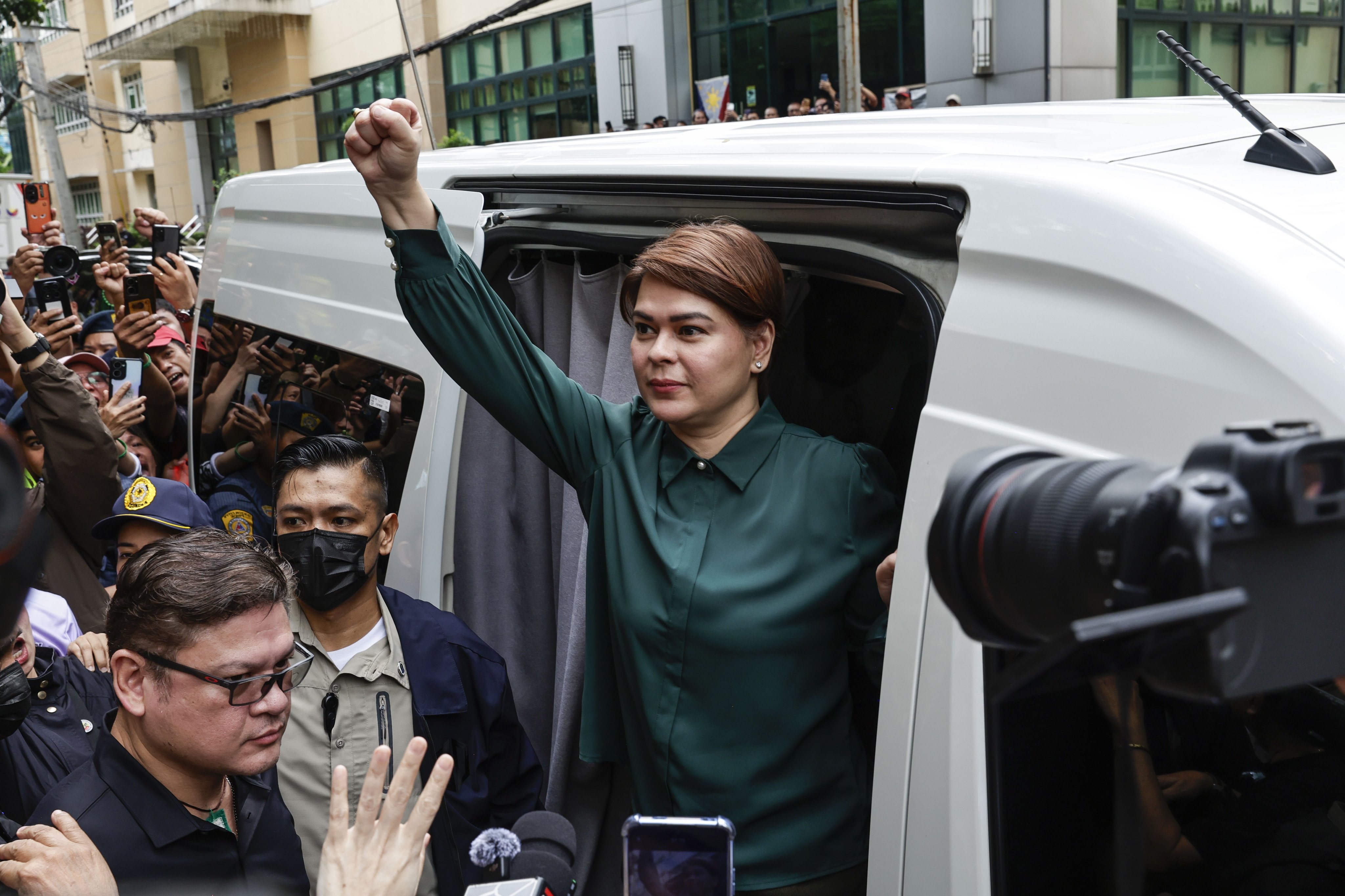 Philippine Vice-President Sara Duterte-Carpio leaves a Quezon City court following a deferred arraignment on grave threat charges in September. Photo: EPA