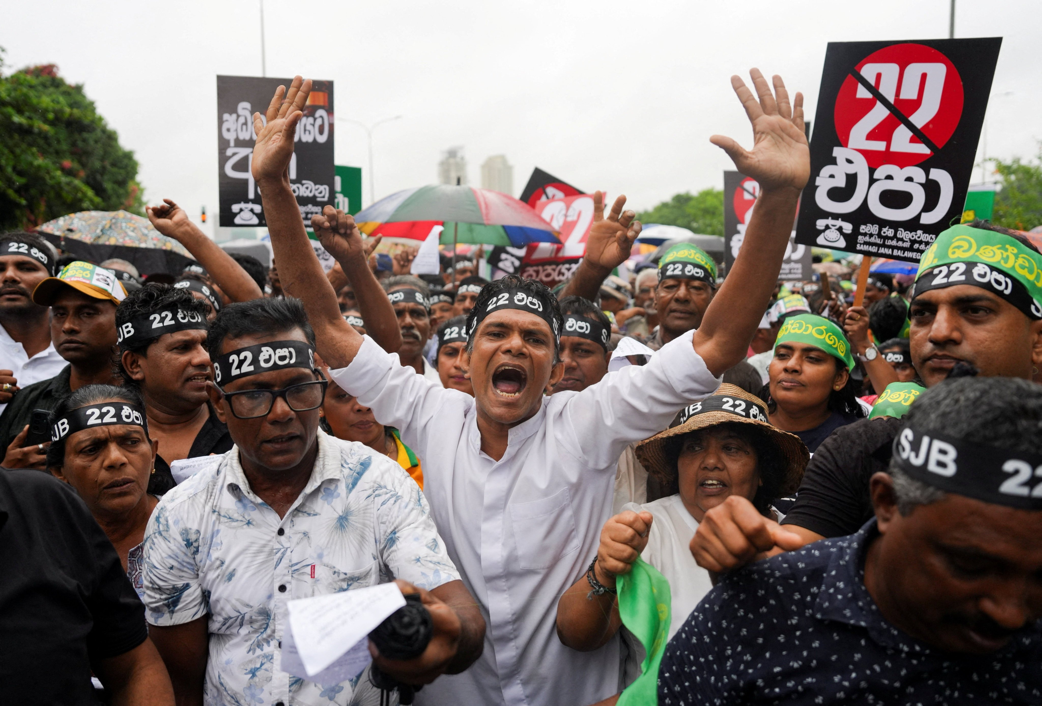 Protesters hold placards chant slogans as they protest against the proposed 22nd Amendment to the constitution at Polduwa Junction in Colombo, Sri Lanka, on Thursday. Photo: Reuters