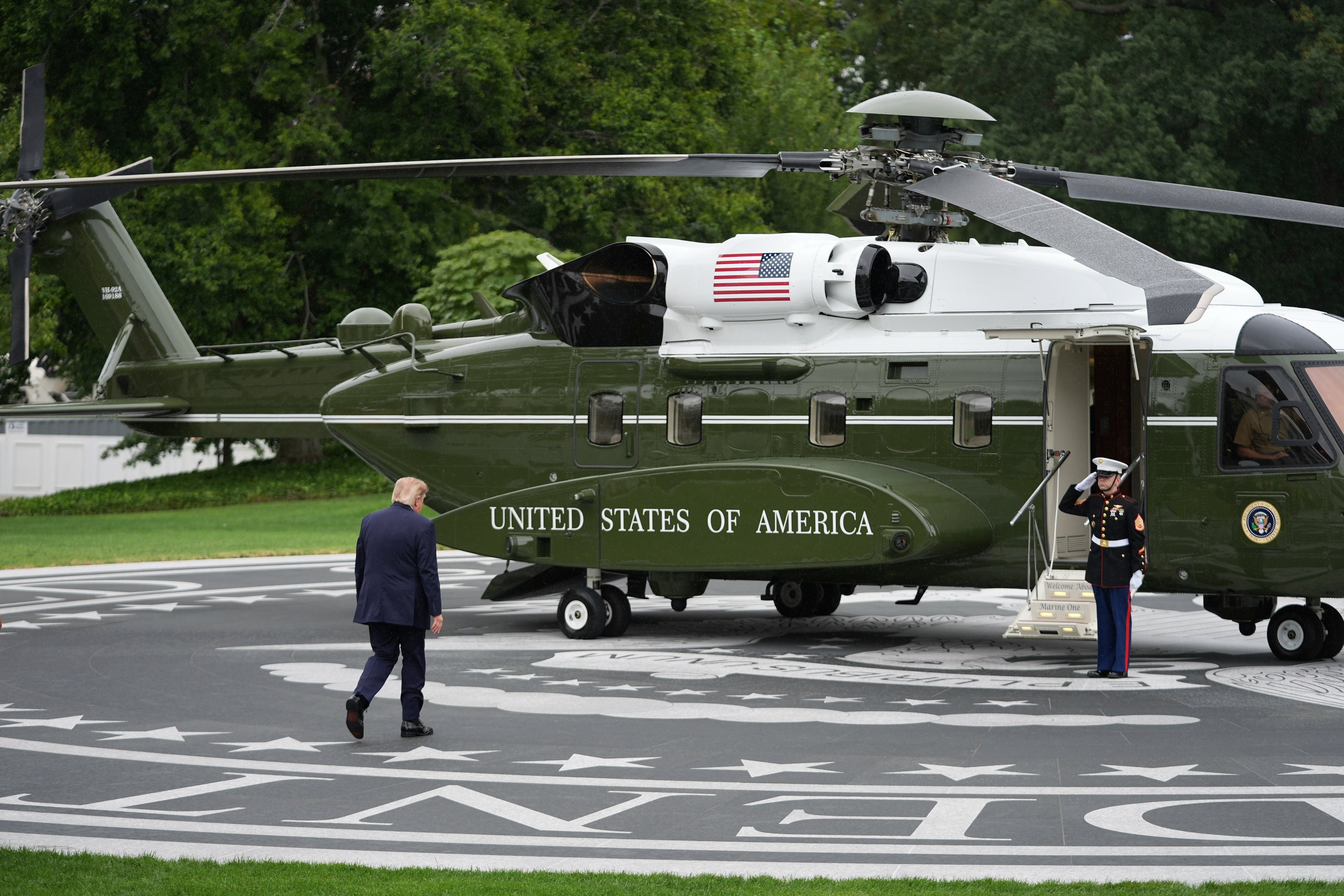 US President Donald Trump walks on a new helipad to board Marine One on the South Lawn of the White House in Washington on Monday. Photo: AP