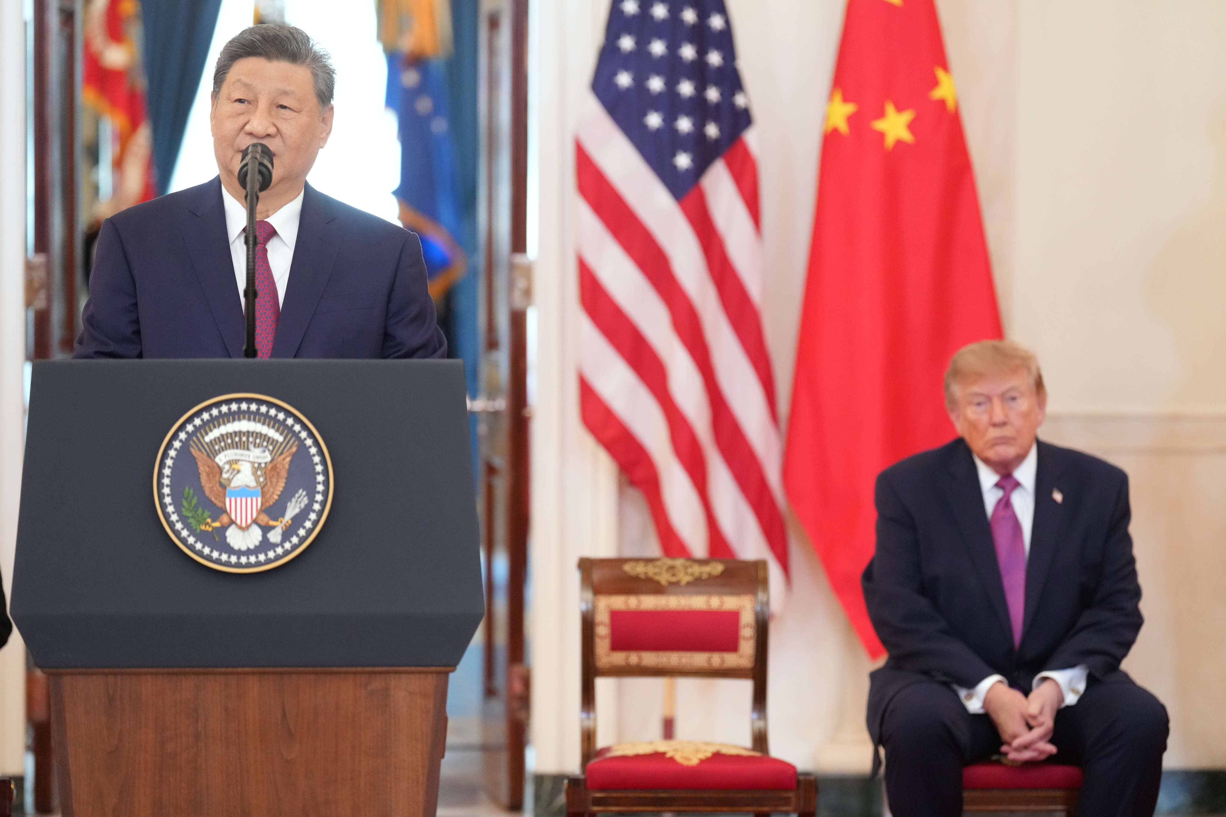 US President Donald Trump listens as China’s President Xi Jinping speaks during in an arrival ceremony in the Grand Foyer of the White House on Thursday. Photo: AP
