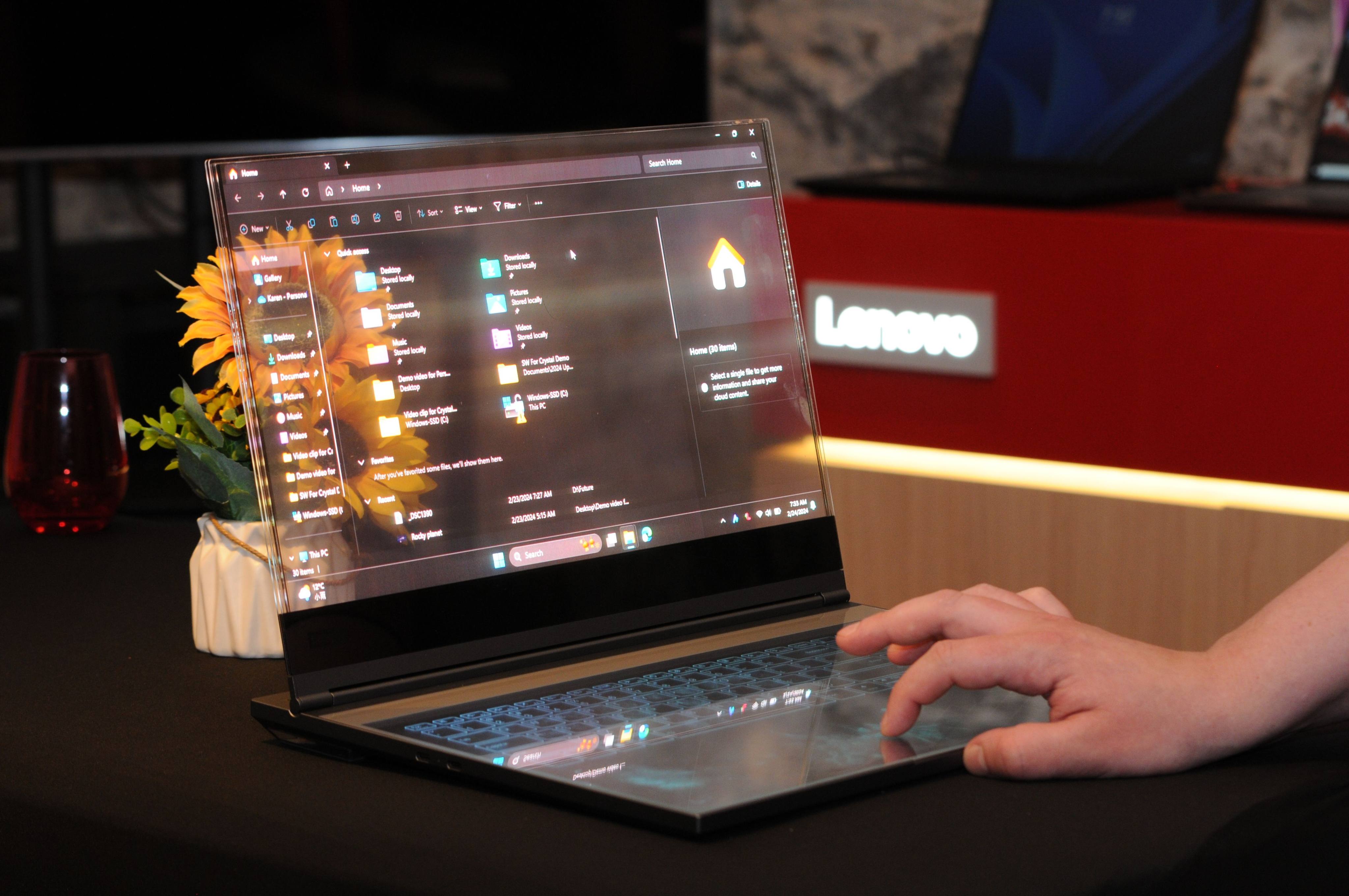 A Lenovo laptop with a transparent screen is displayed at the Mobile World Congress in Spain. Photo: dpa