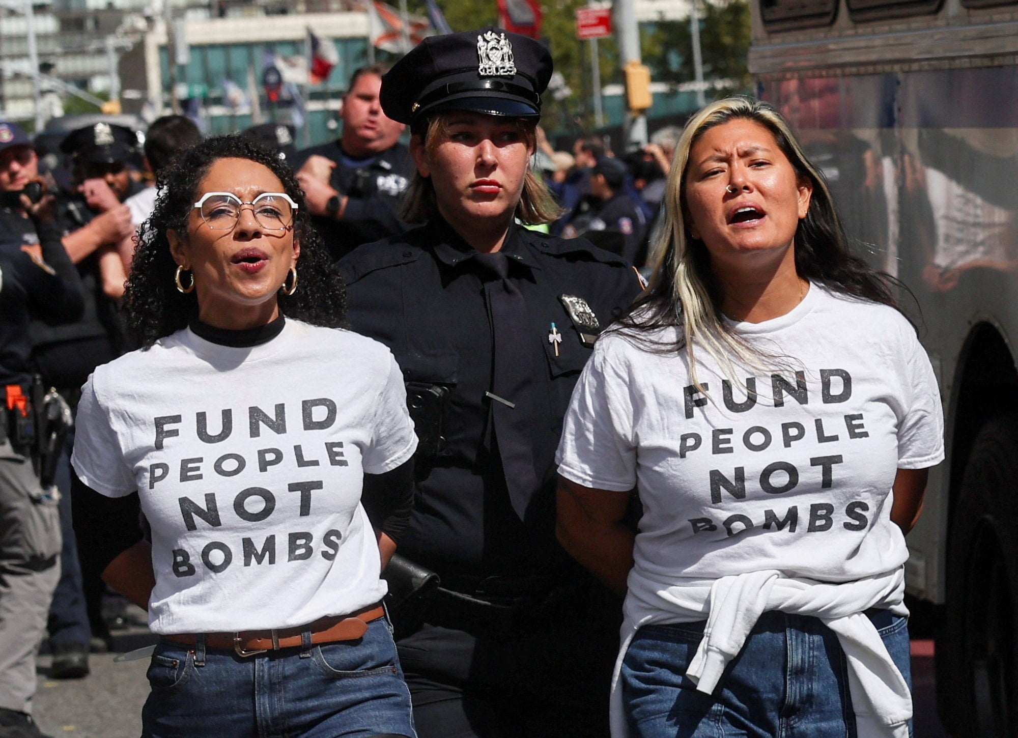 Democratic congressional candidate Darializa Avila Chevalier is detained alongside another protester. Photo: Reuters