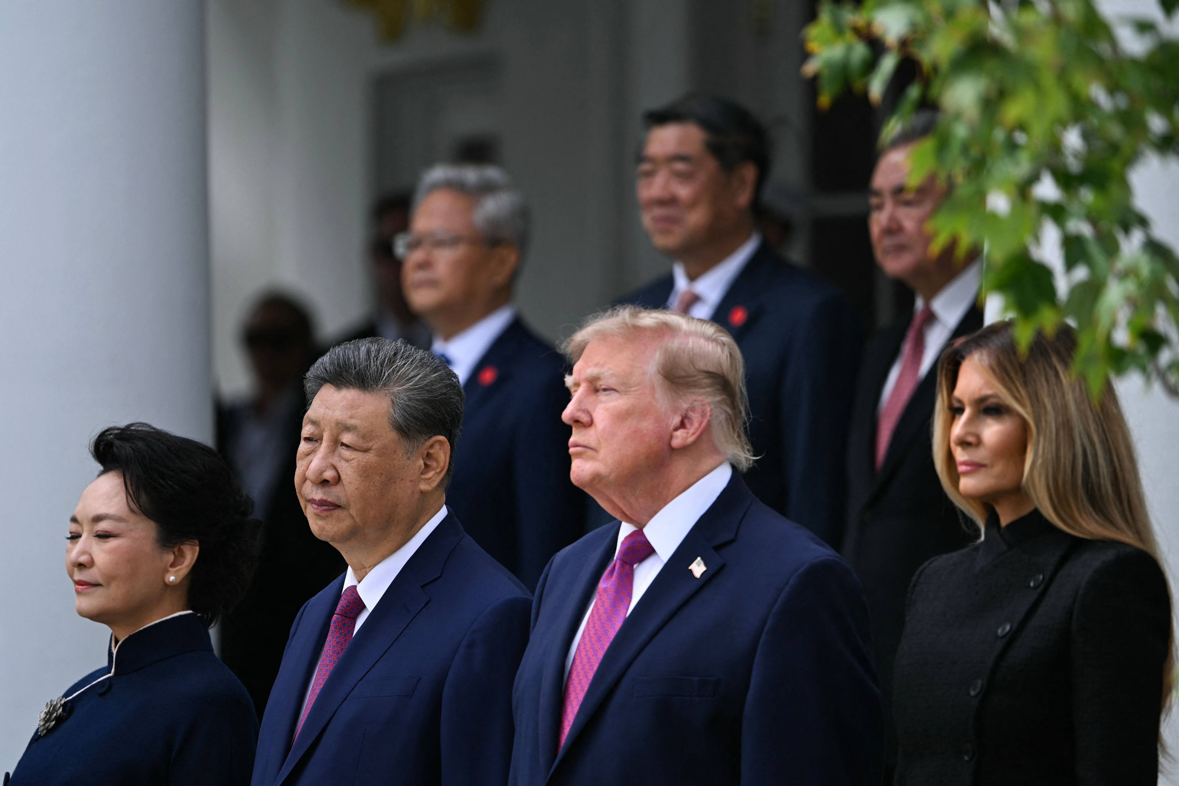 From left, China’s first lady Peng Liyuan, China’s President Xi Jinping, US President Donald Trump and US first lady Melania Trump look on during a military review in the Rose Garden of the White House on Thursday. Photo: AFP