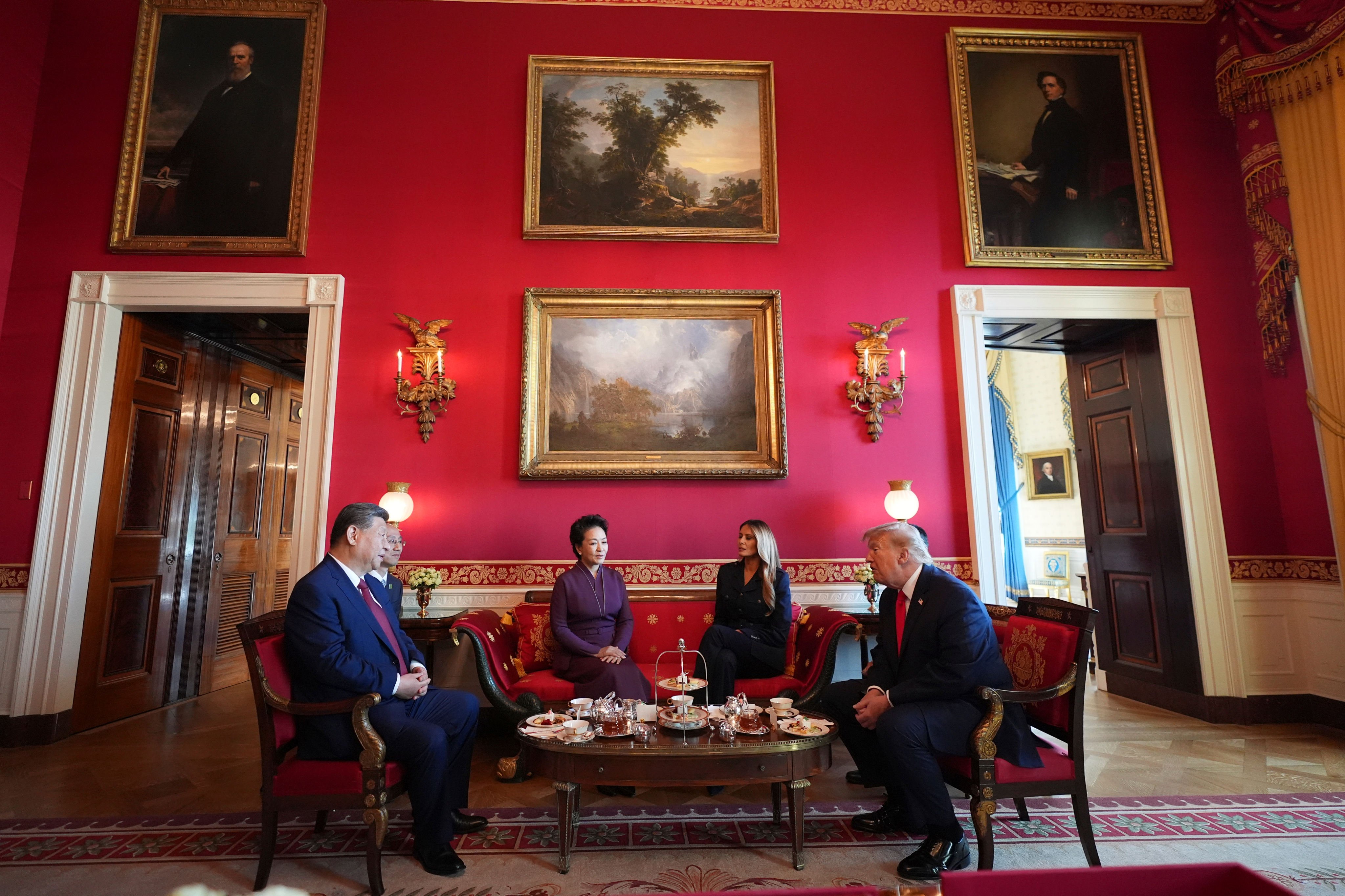 The group meet for tea in the Red Room of the White House. Photo: AP