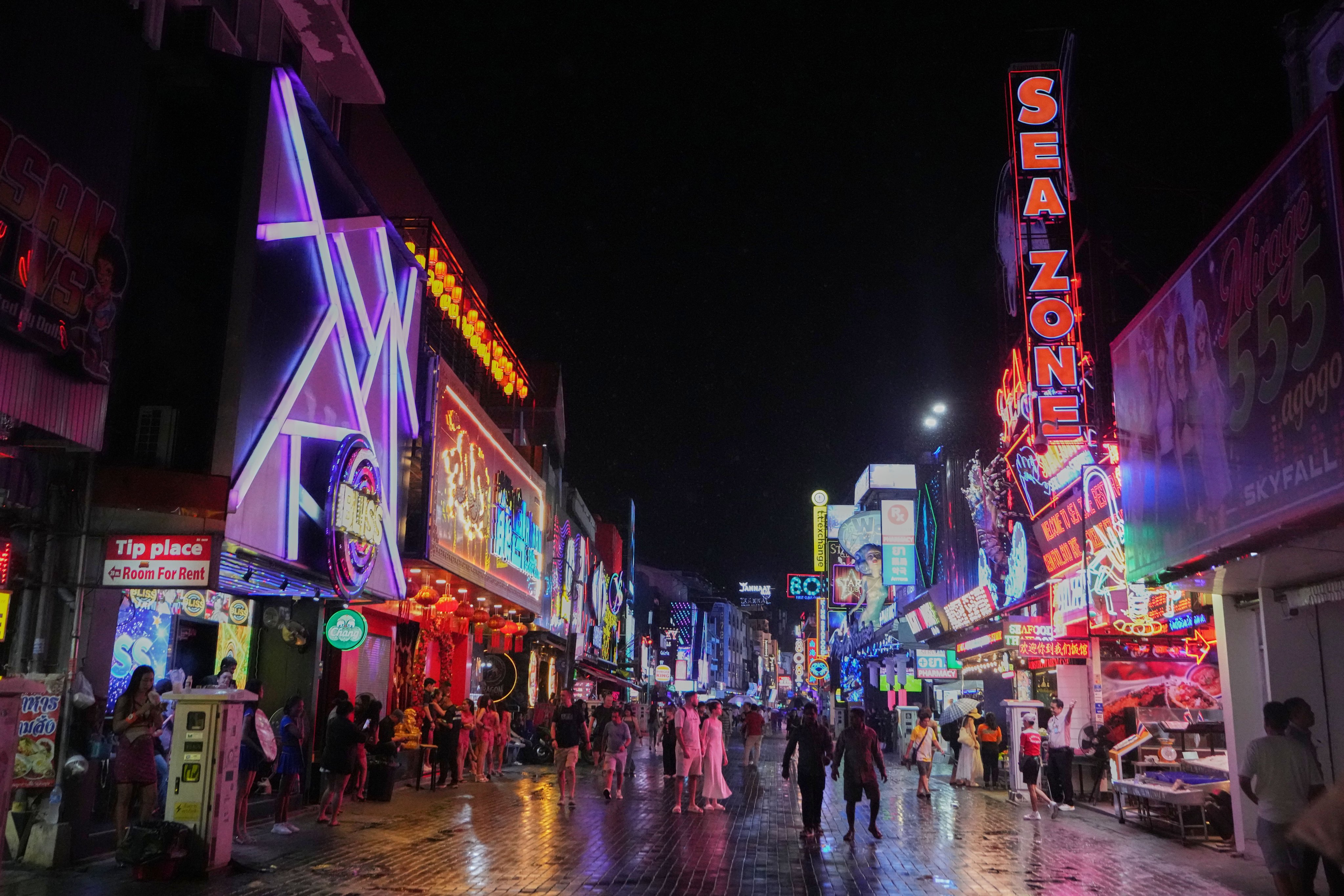 Tourists stroll down Walking Street in Pattaya, Thailand, in August. Photo: AP