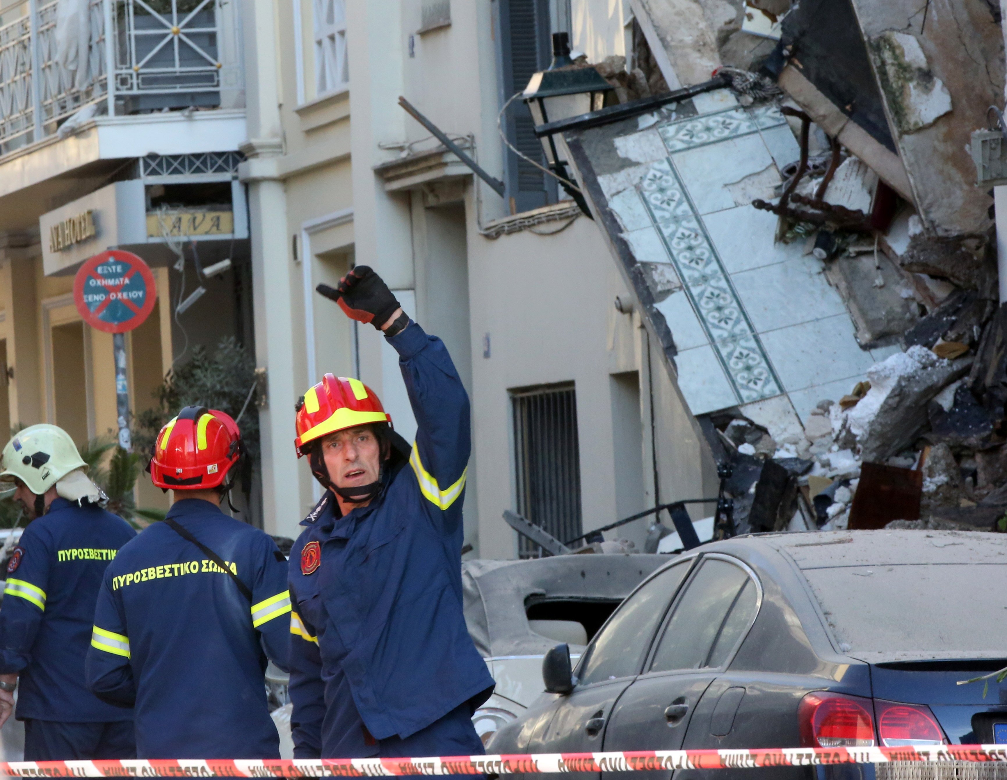 Firefighters work at the scene of a partially collapsed two-story building on Lysikratous Street in the Plaka district of Athens on Friday. Photo: EPA