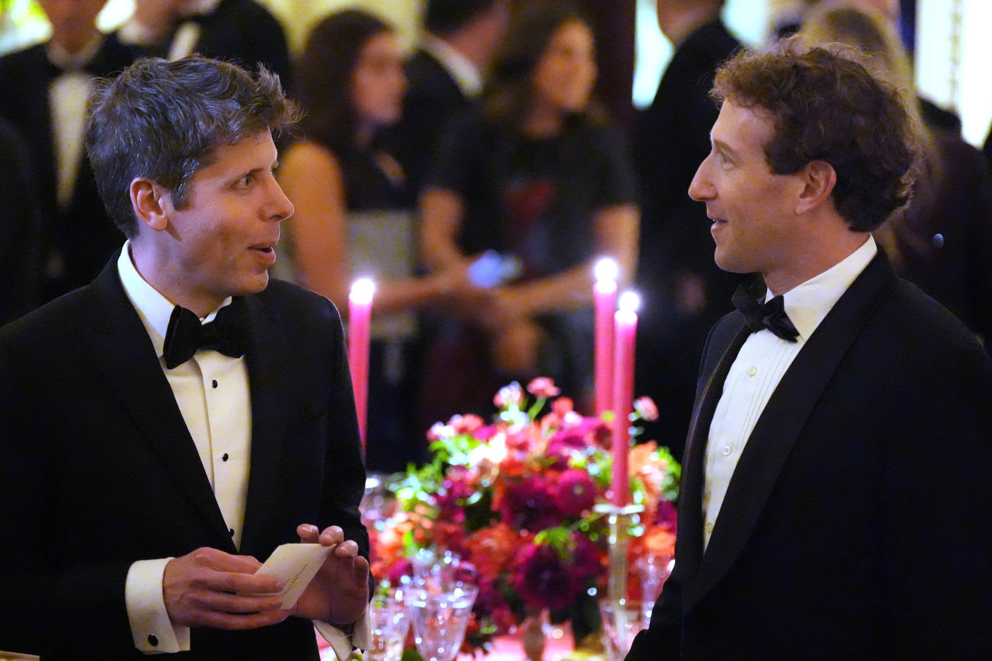 OpenAI CEO Sam Altman talks with Meta CEO Mark Zuckerberg during the dinner. Photo: AP