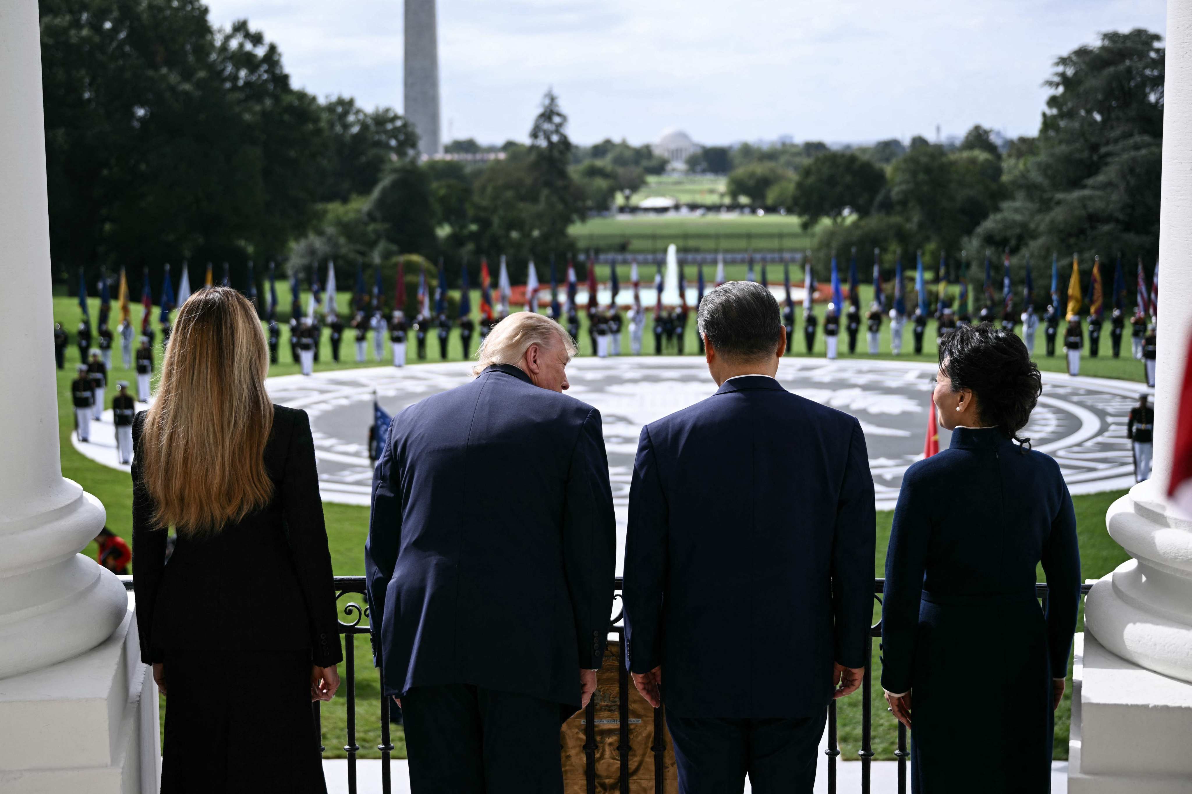 Left to right: US first lady Melania Trump, US President Donald Trump, China’s President Xi Jinping and China’s first lady Peng Liyuan stand on the Blue Room balcony of the White House to watch an exhibition of the US Marine Corps Silent Drill Platoon on Thursday. Photo: AFP