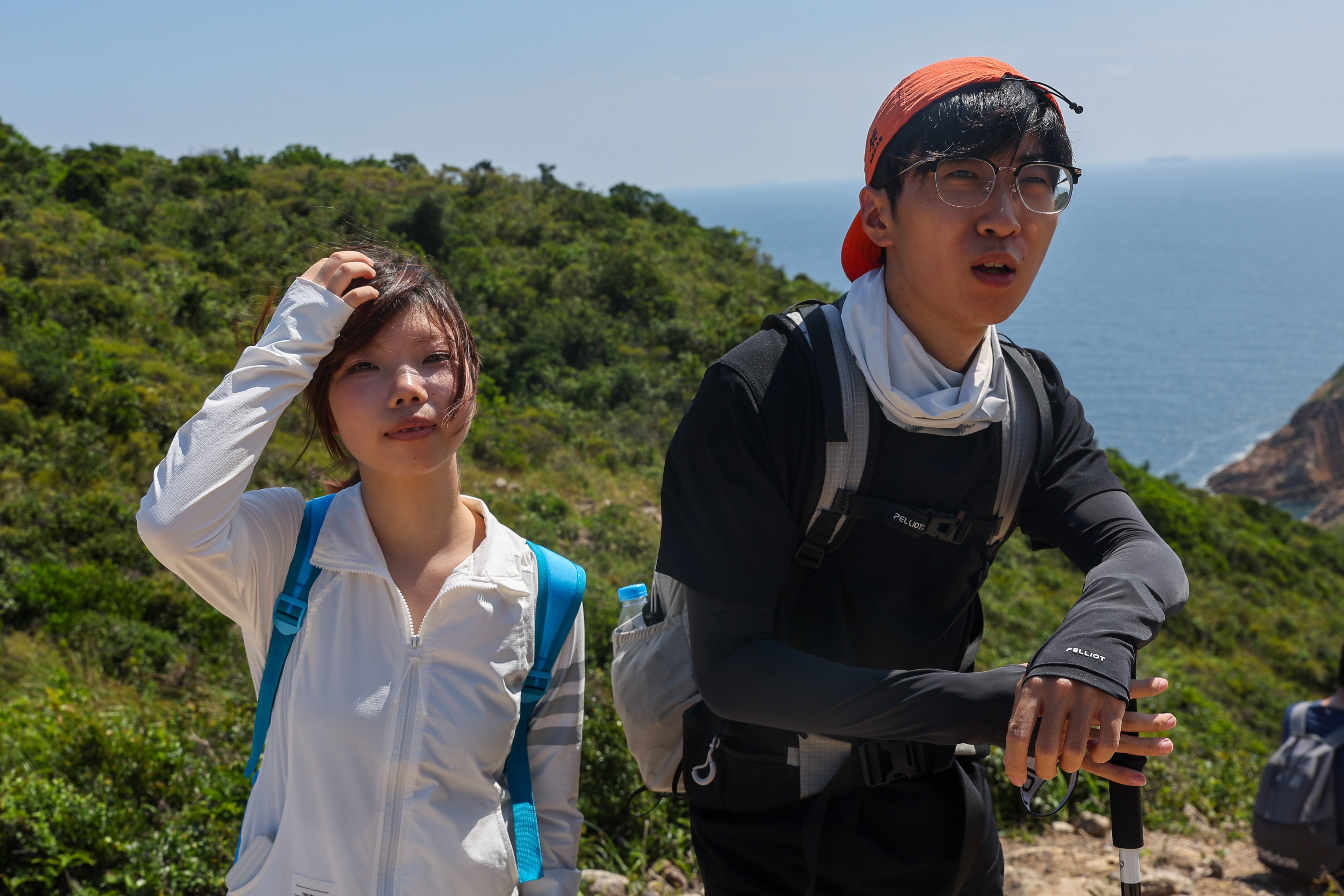 Mainland Chinese tourists Dan Wang (right) and his friend visit Po Pin Chau, located in Hong Kong's Unesco Global Geopark. Photo: Edmond So