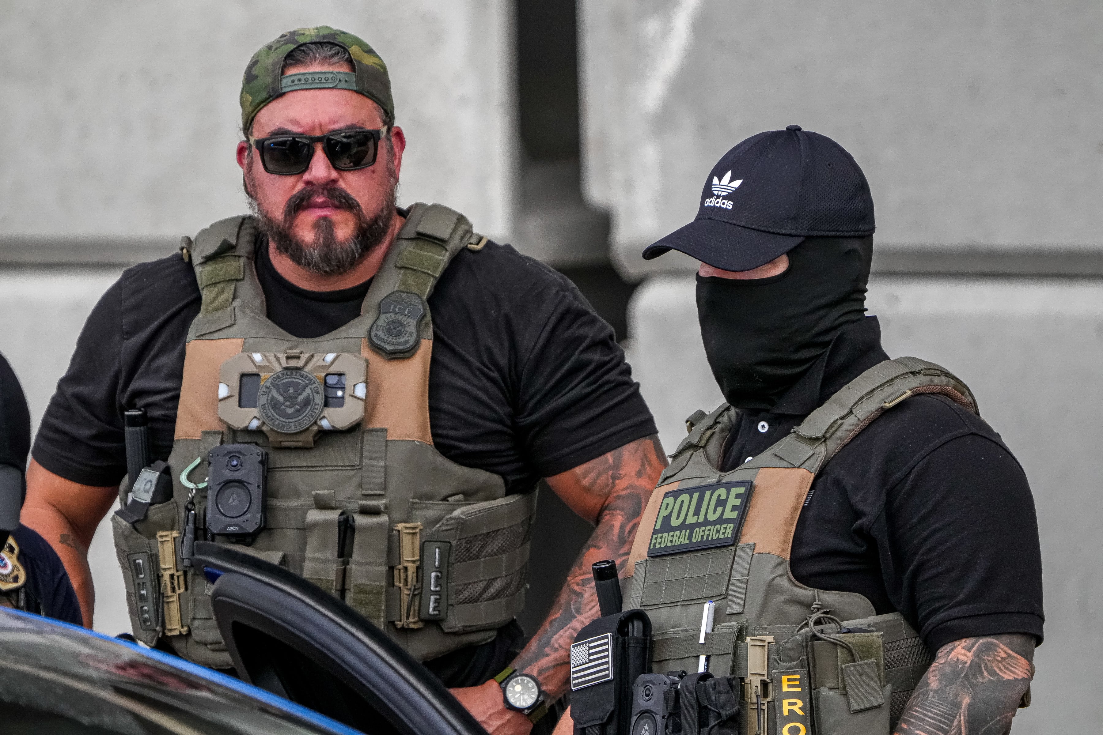 ICE officers at the scene where Venezuelan migrant, Wilber Garces Perez, was shot and wounded in Austin, Texas. Photo: Austin American-Statesman via AP