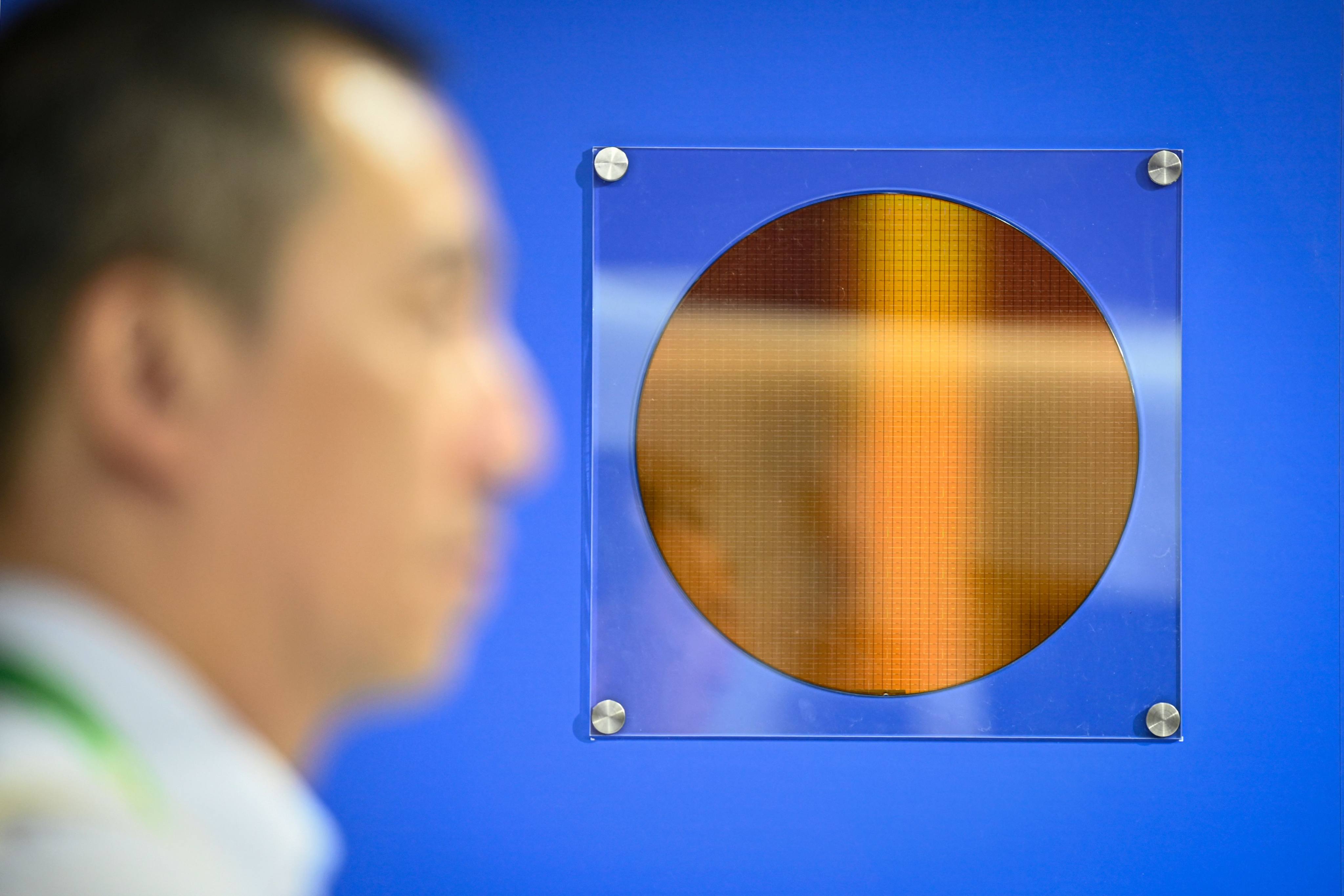 A 12-inch silicon wafer is displayed at the China International Supply Chain Expo in Beijing on July 16, 2025. Photo: AFP