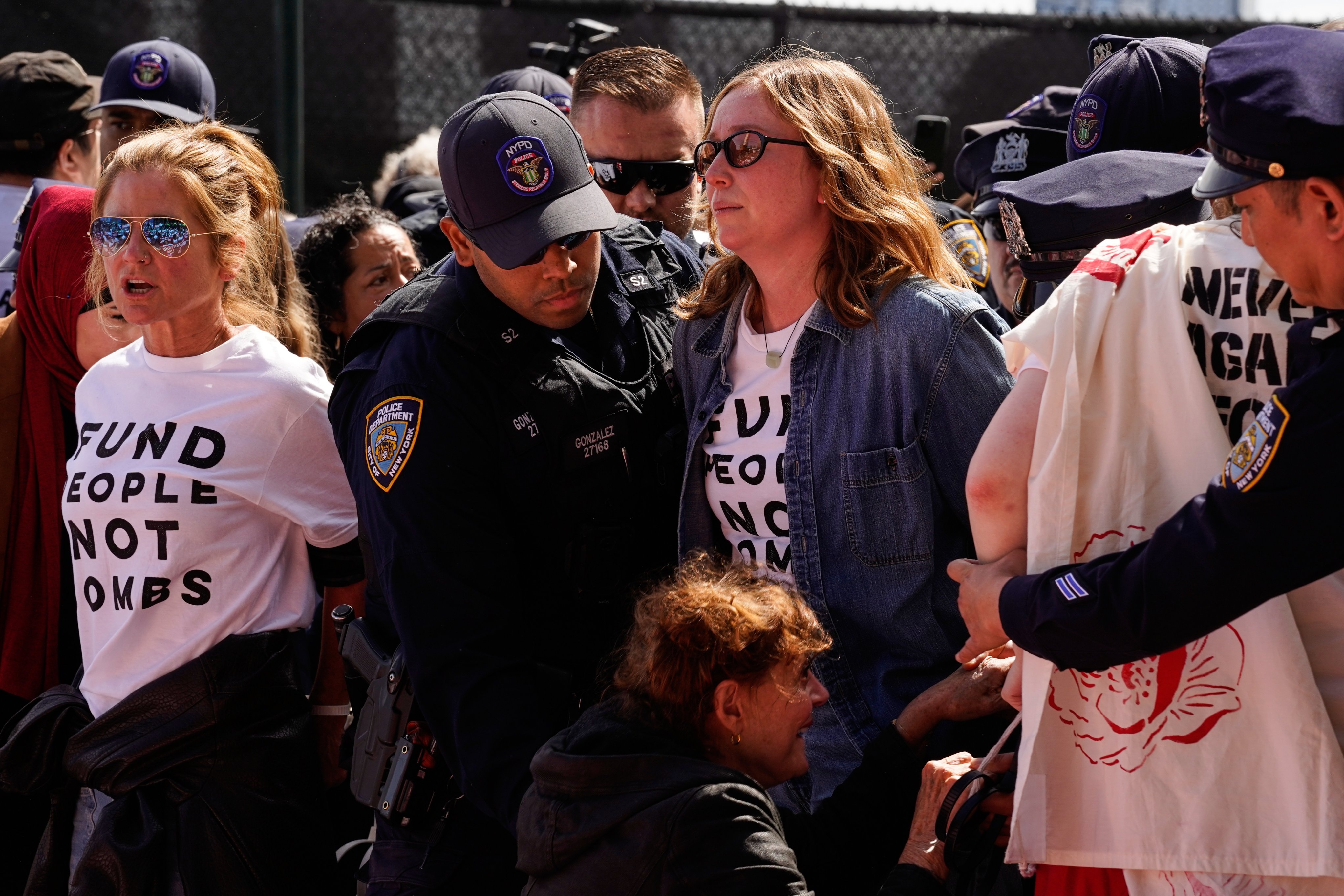 Hannah Einbinder, centre, and other demonstrators being arrested. Photo: AP