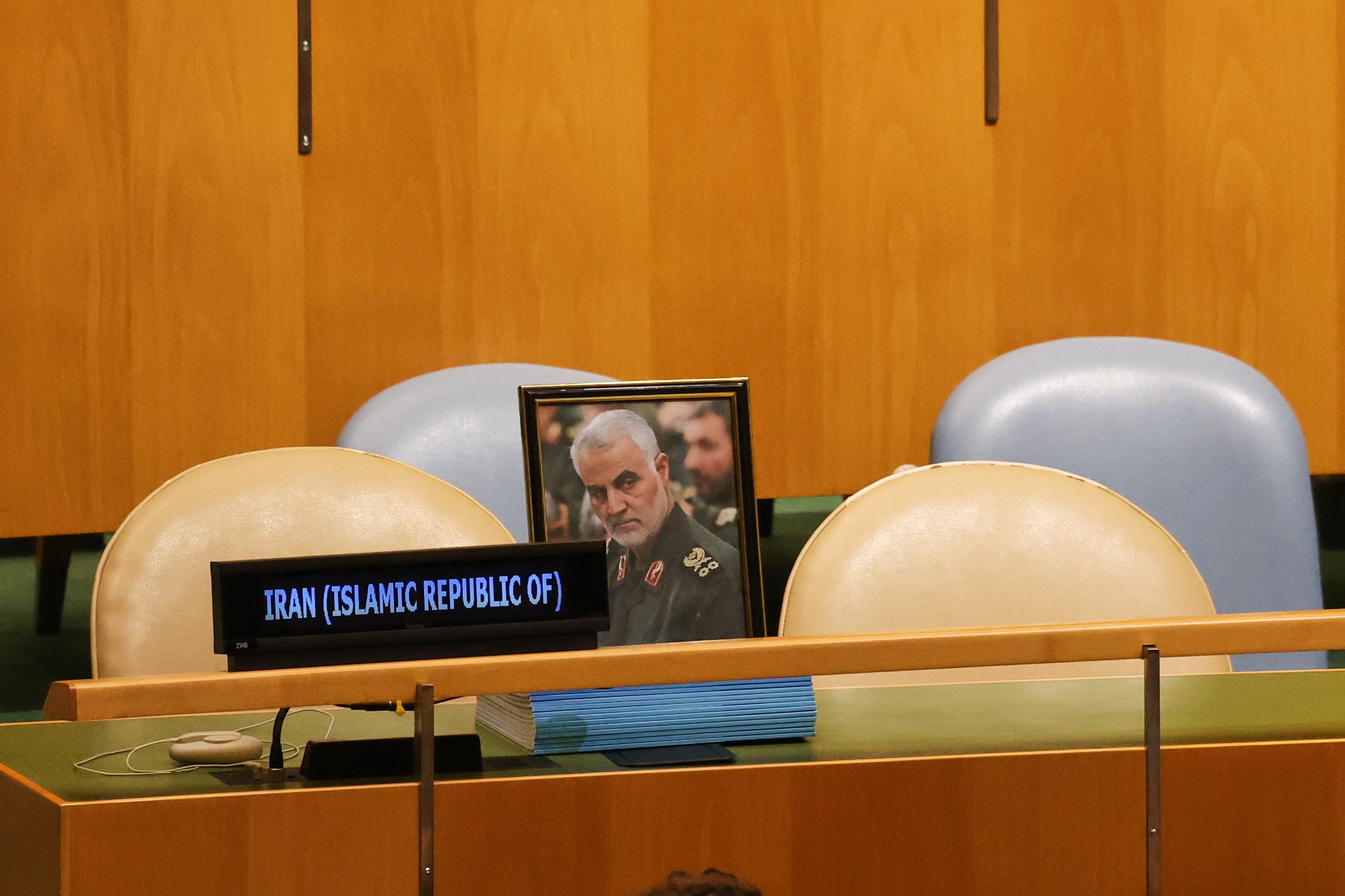 Empty seats and a photo of slain Iranian general Qassem Soleimani. Photo: AP