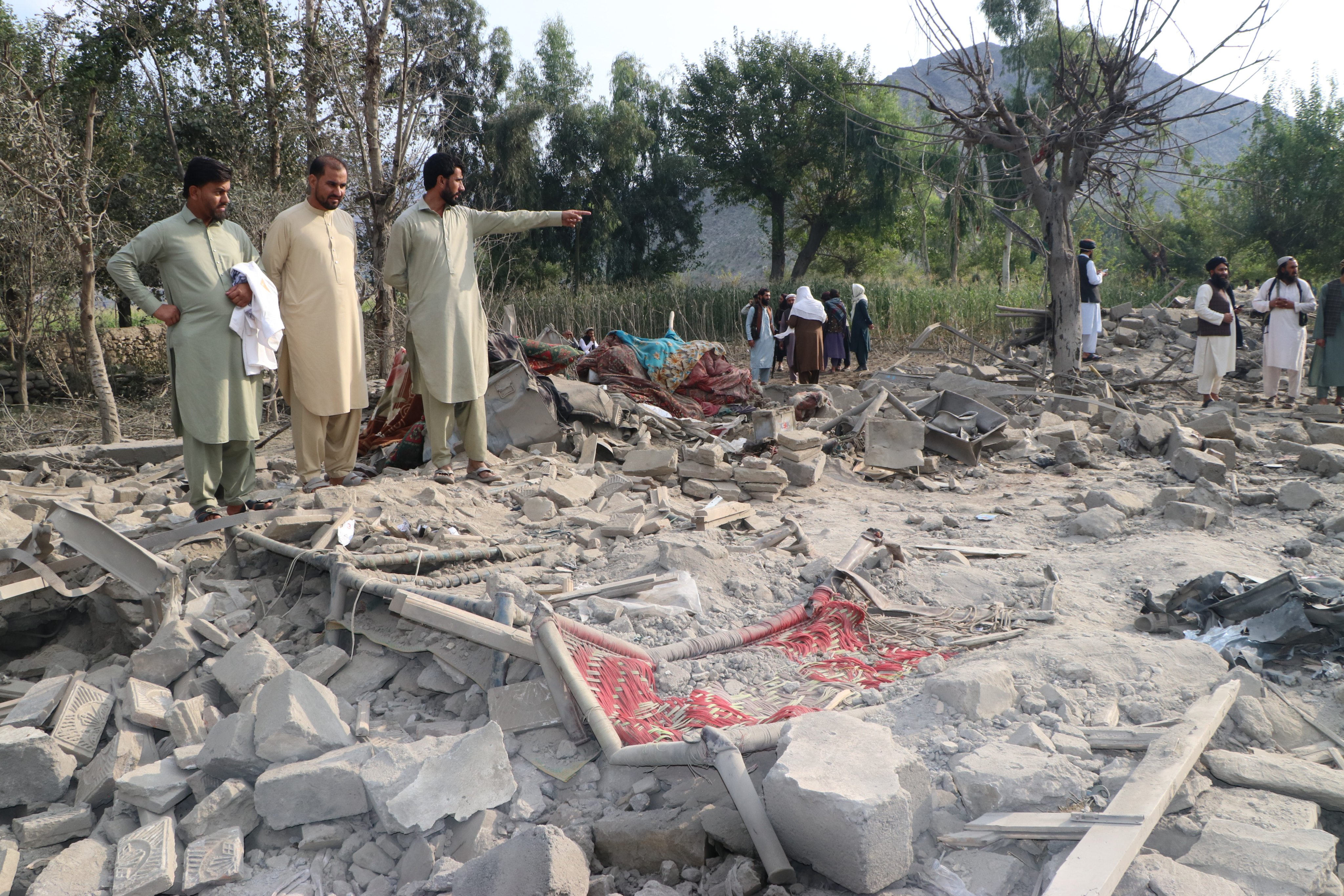 Residents inspect a damaged house following an air strike in a village in Nurgal district of Kunar province, Afghanistan, on Monday. Photo: Xinhua